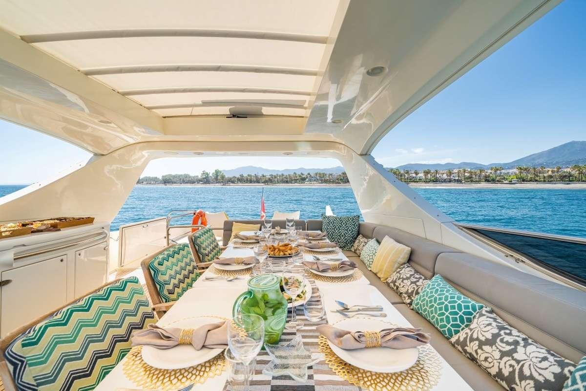 a table set for a meal on a boat aboard M Yacht for Charter