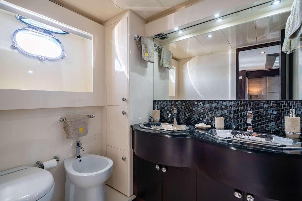 a bathroom with a large mirror aboard M Yacht for Charter