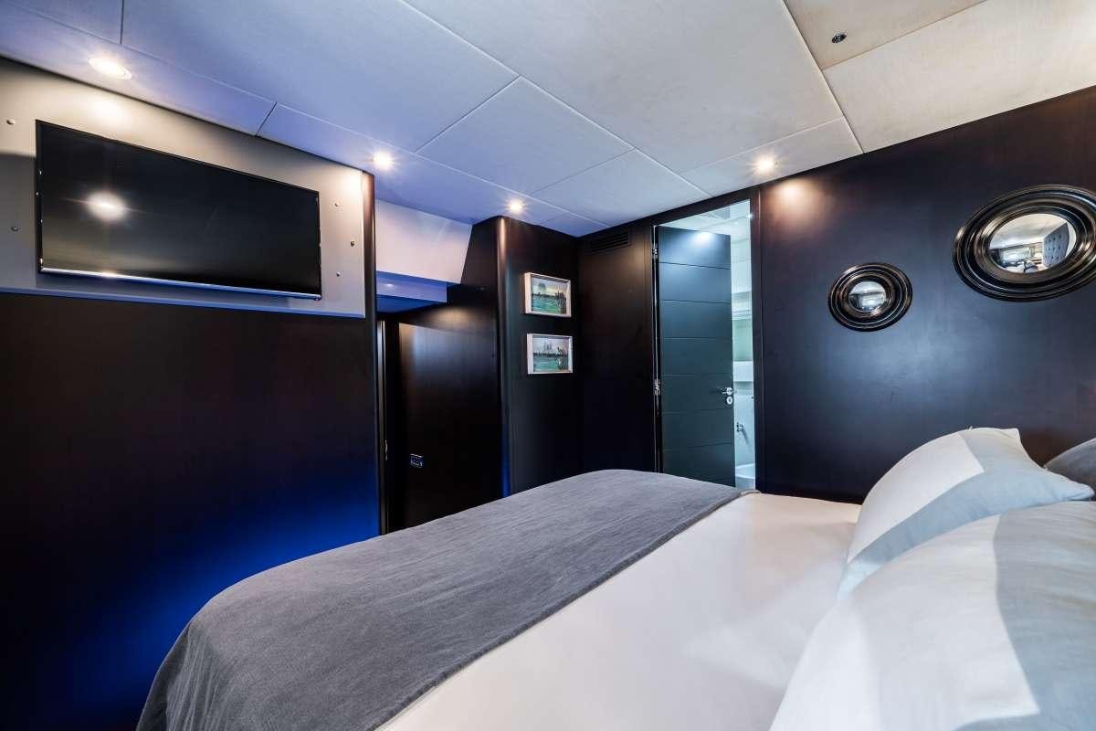 a bed in a room aboard M Yacht for Charter