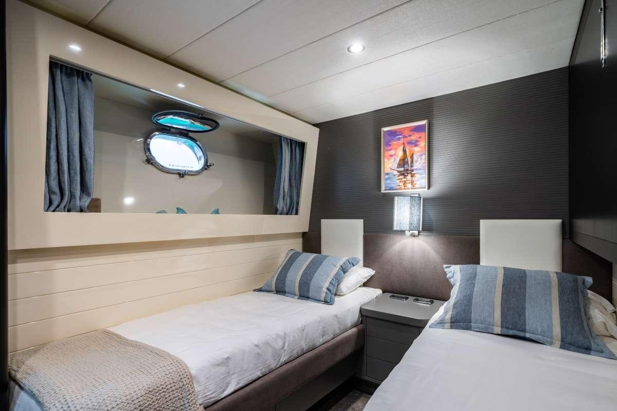 a room with two beds aboard M Yacht for Charter