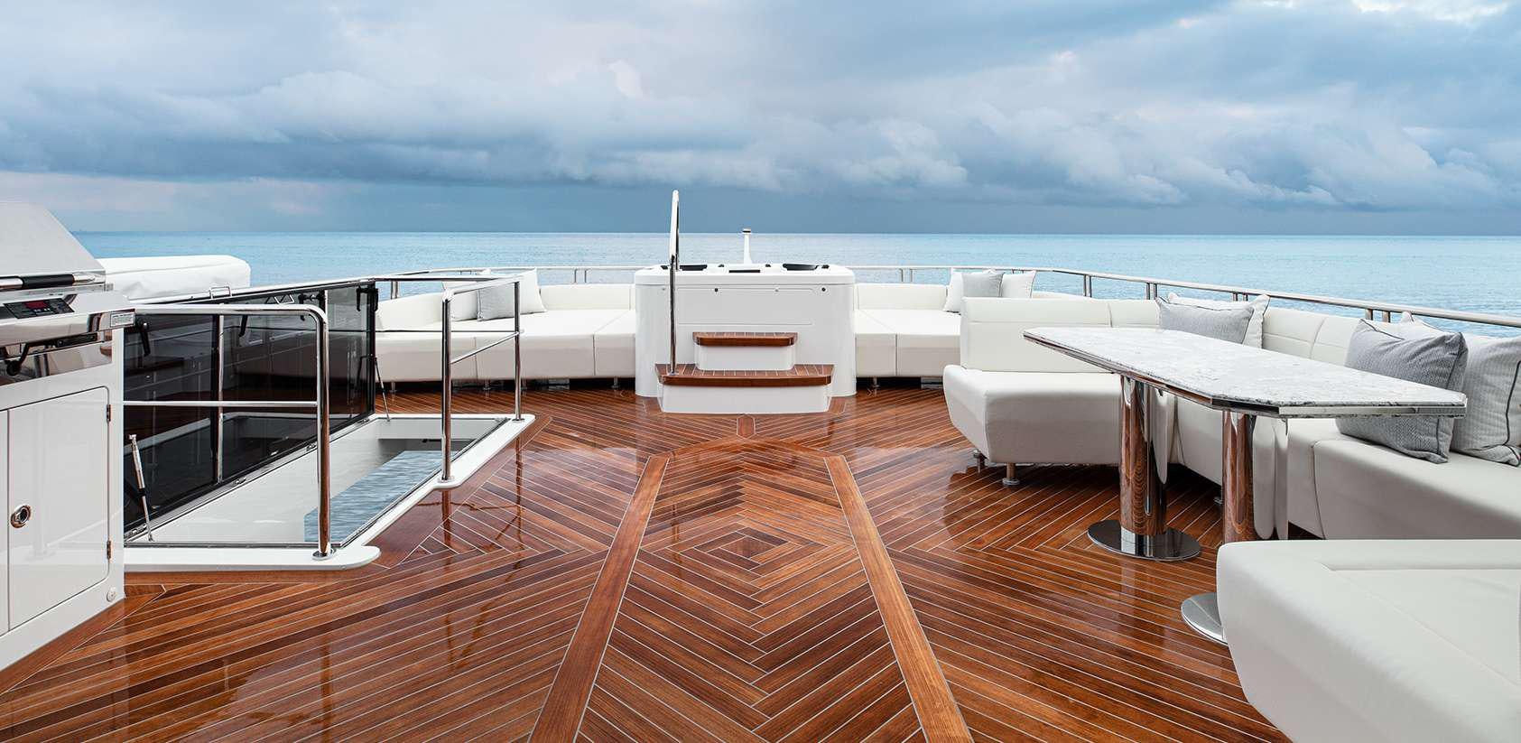 a deck with a view of the ocean and a deck aboard OCEAN ALEXANDER 27R03 Yacht for Charter