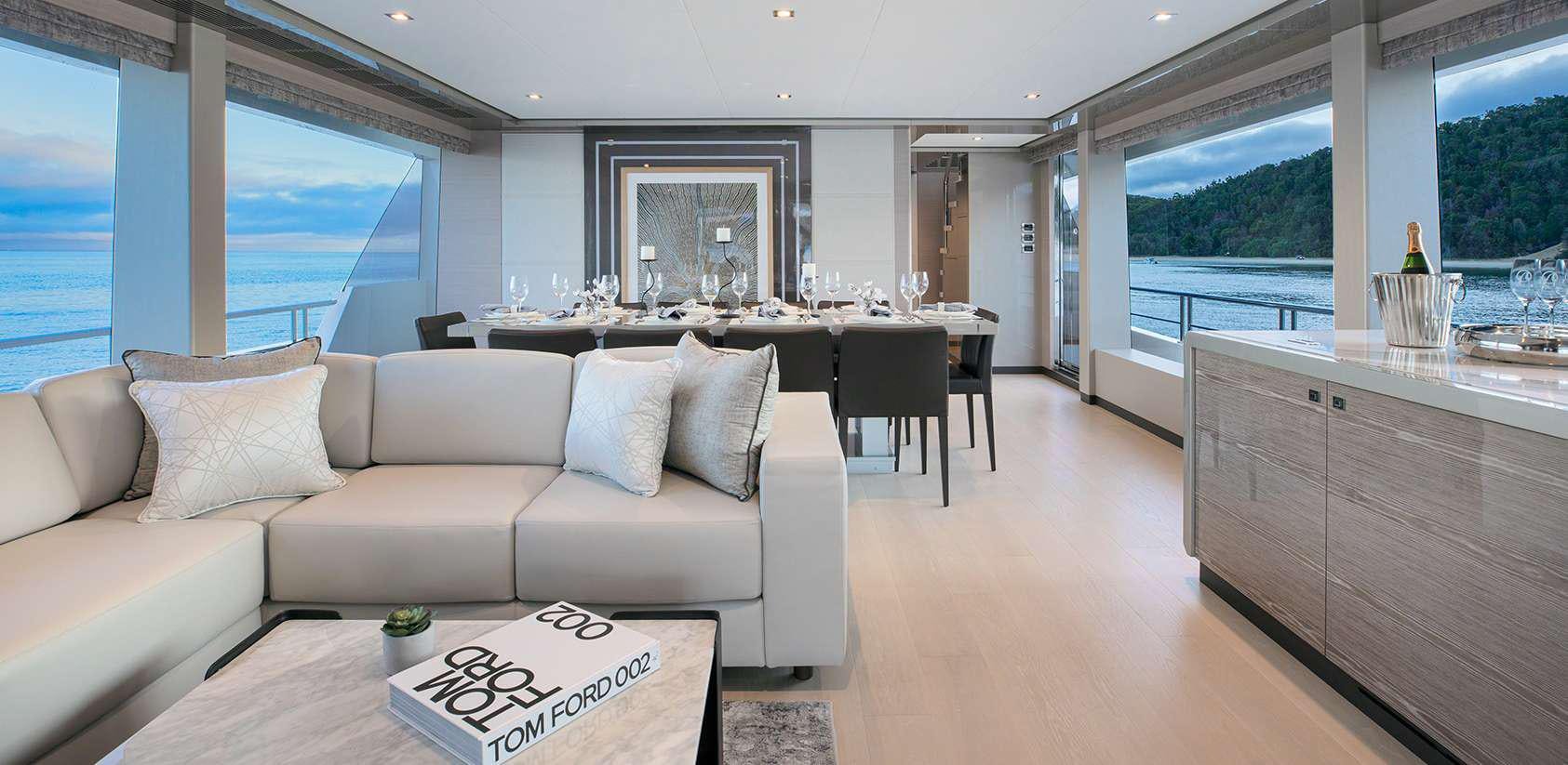 a living room with a large window aboard OCEAN ALEXANDER 27R03 Yacht for Charter