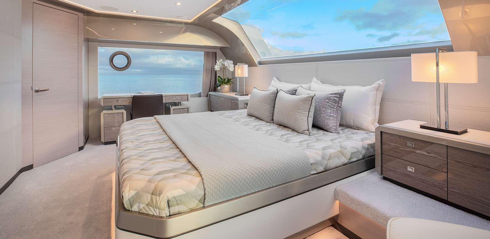 a large bed in a hotel room aboard OCEAN ALEXANDER 27R03 Yacht for Charter