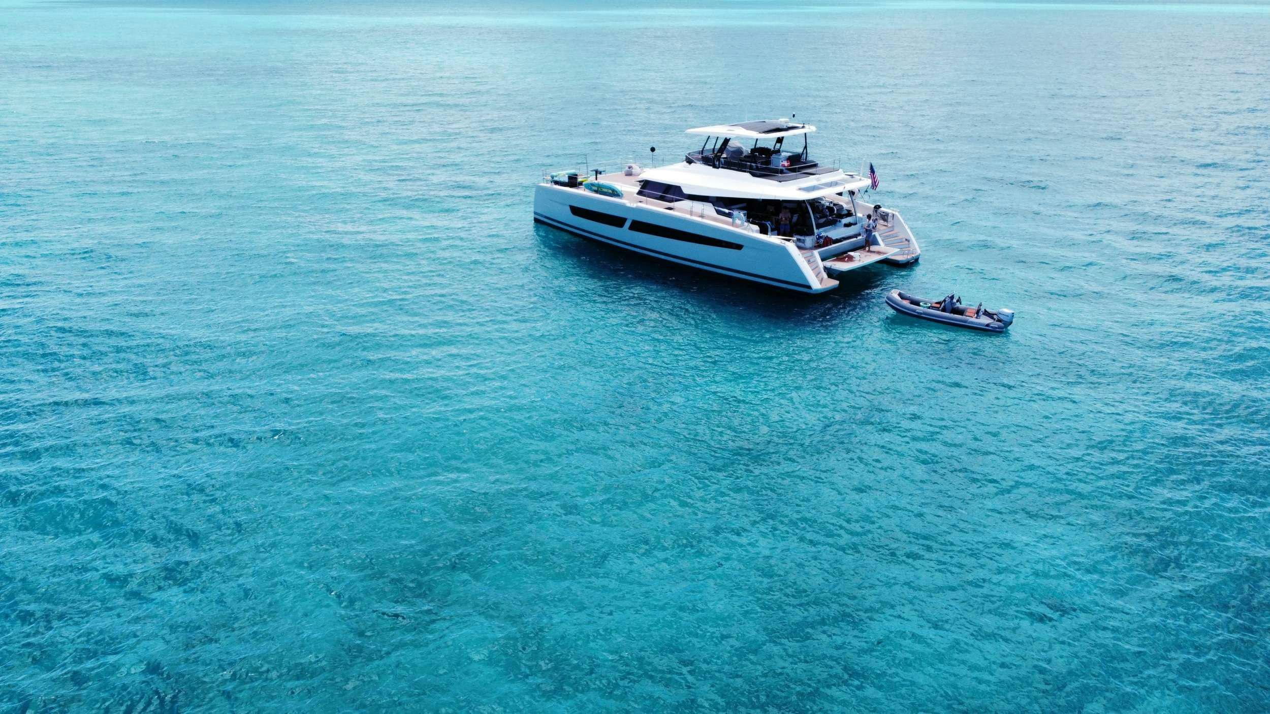 a couple of boats in the ocean aboard PRINCESS MILA Yacht for Charter