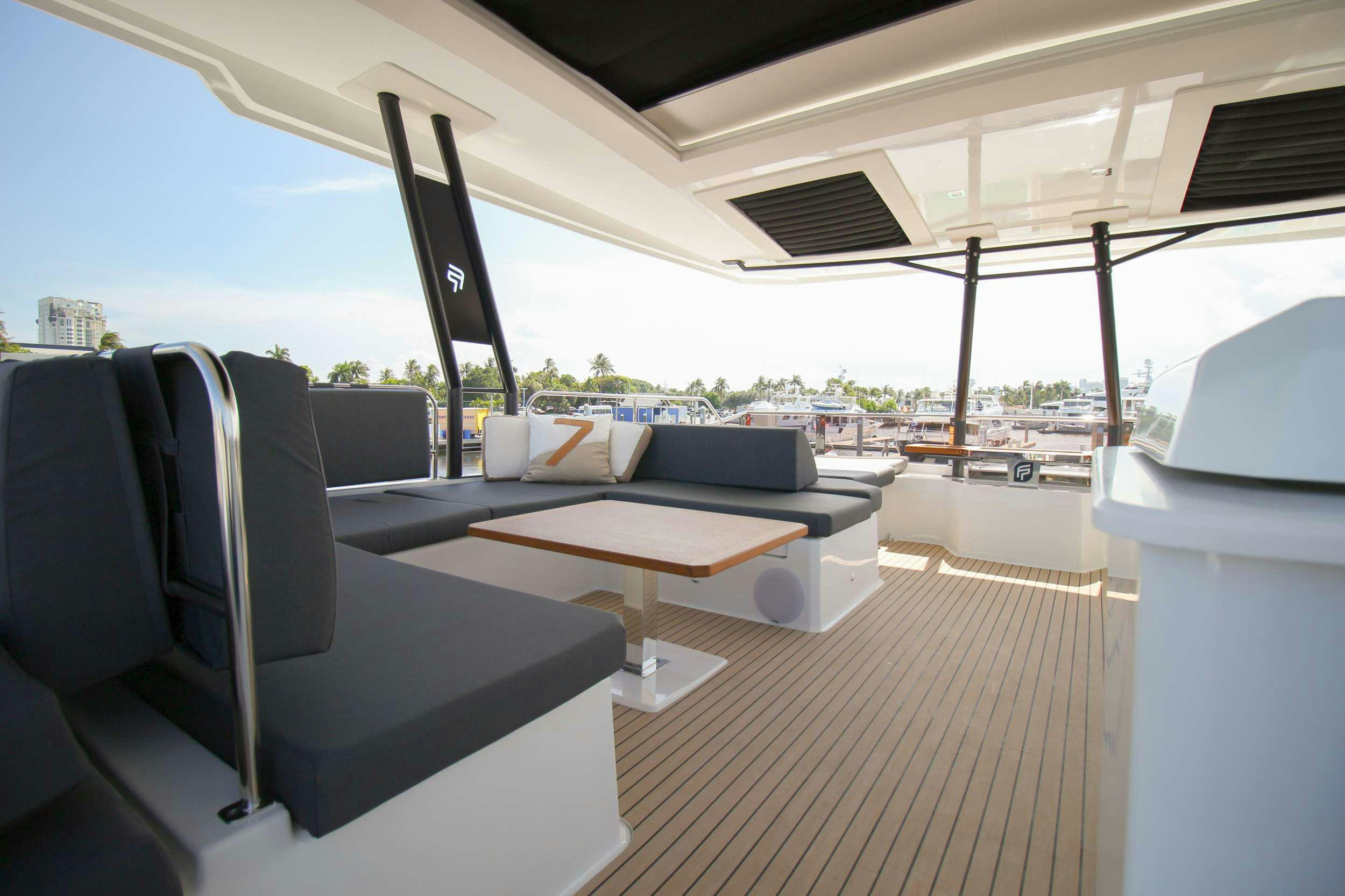 a room with a couch and a table aboard PRINCESS MILA Yacht for Charter