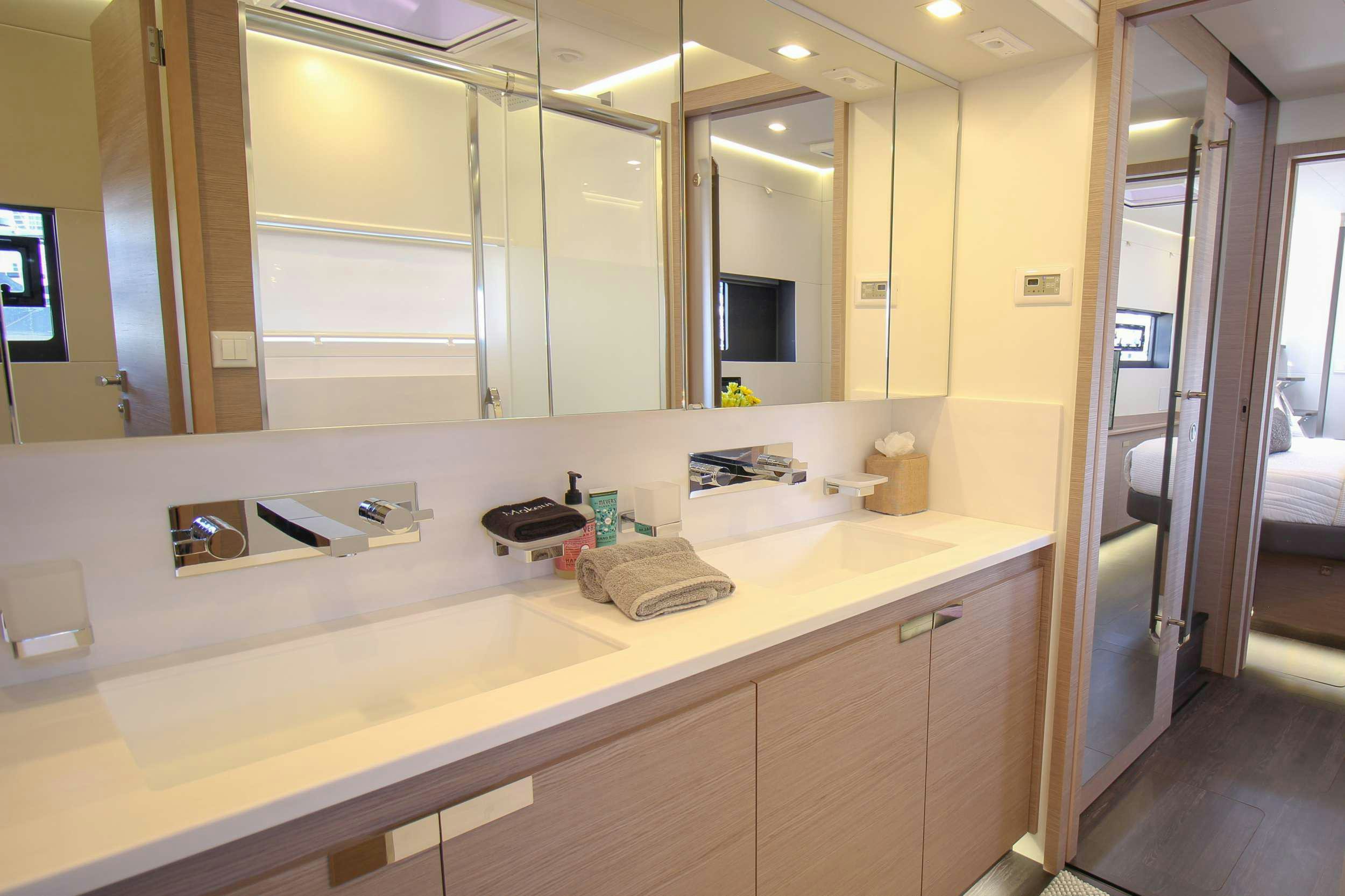 a bathroom with a large mirror aboard PRINCESS MILA Yacht for Charter