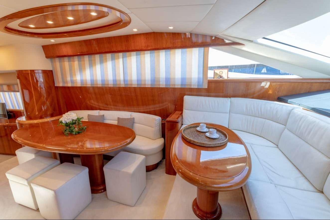 a room with a table and chairs aboard VENUS SECRETS Yacht for Charter