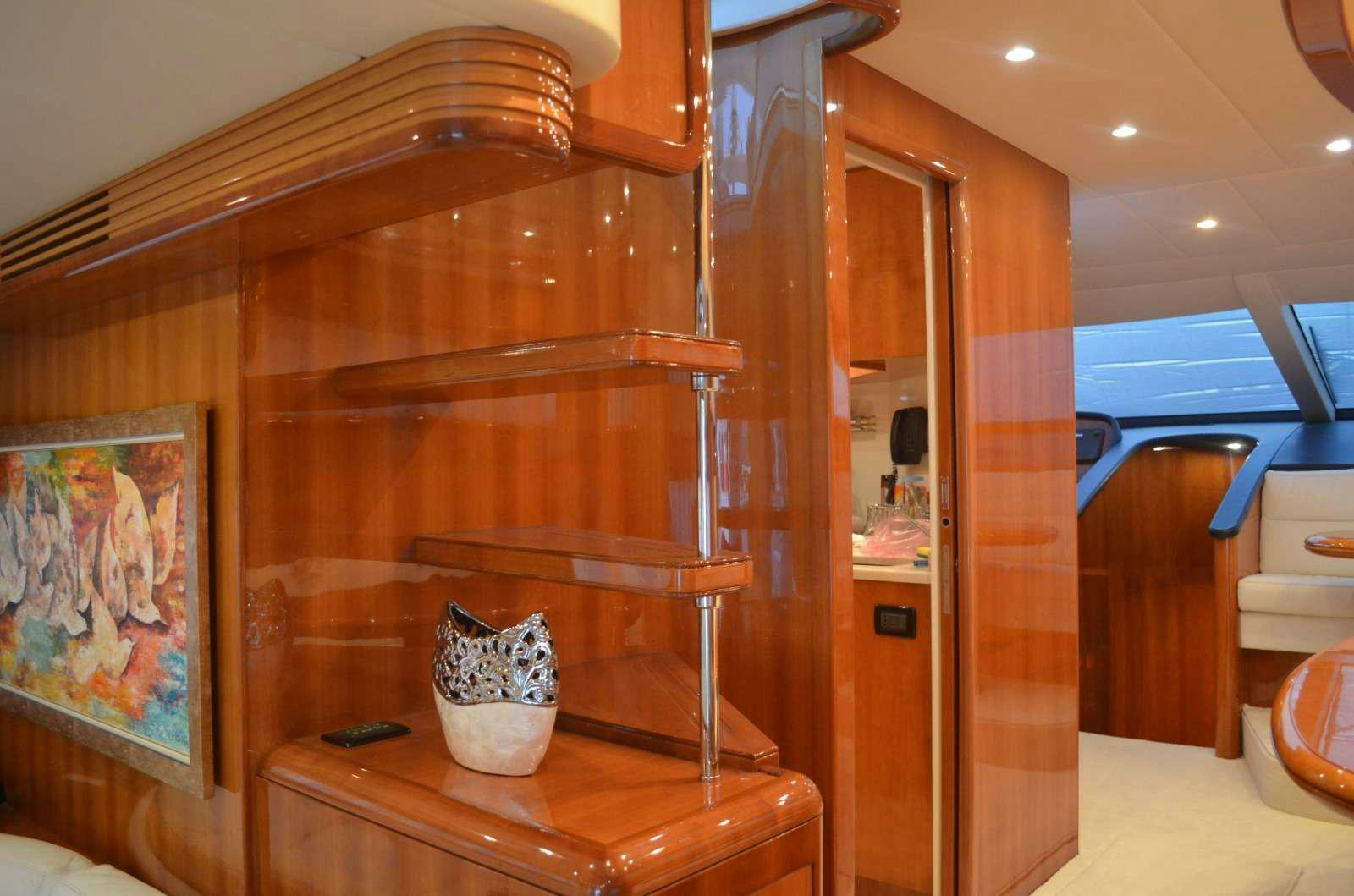 a wooden cabinet with a vase on it aboard VENUS SECRETS Yacht for Charter