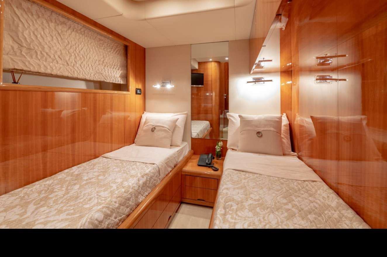 a room with two beds aboard VENUS SECRETS Yacht for Charter