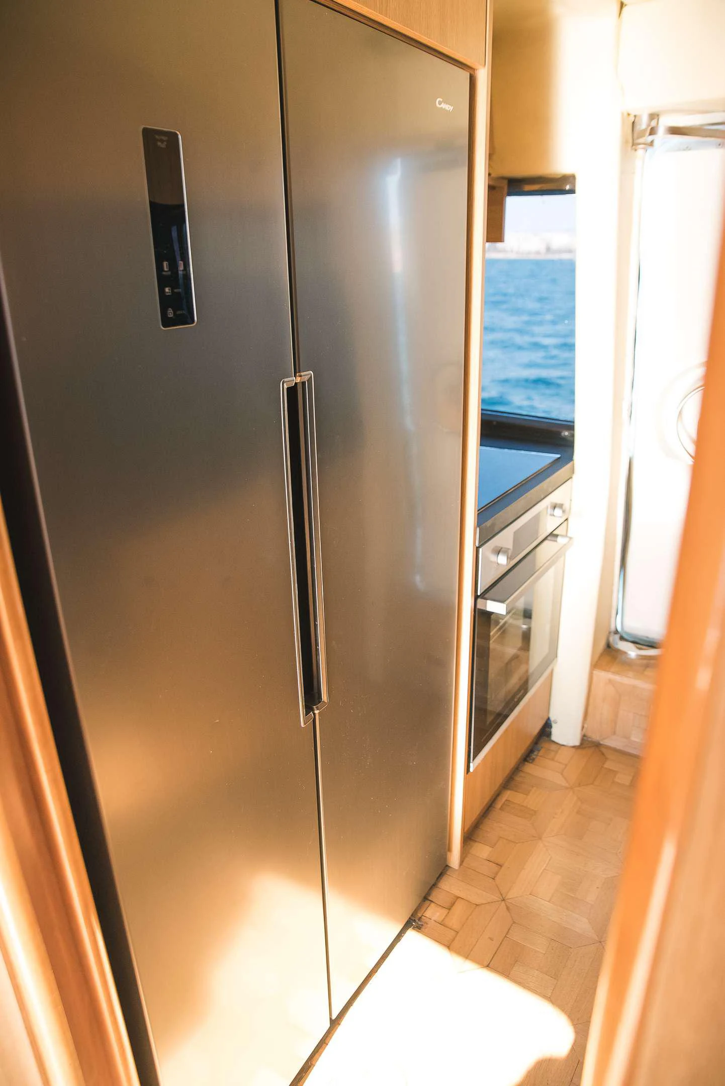 a refrigerator in a kitchen aboard TEMPTATION Yacht for Charter