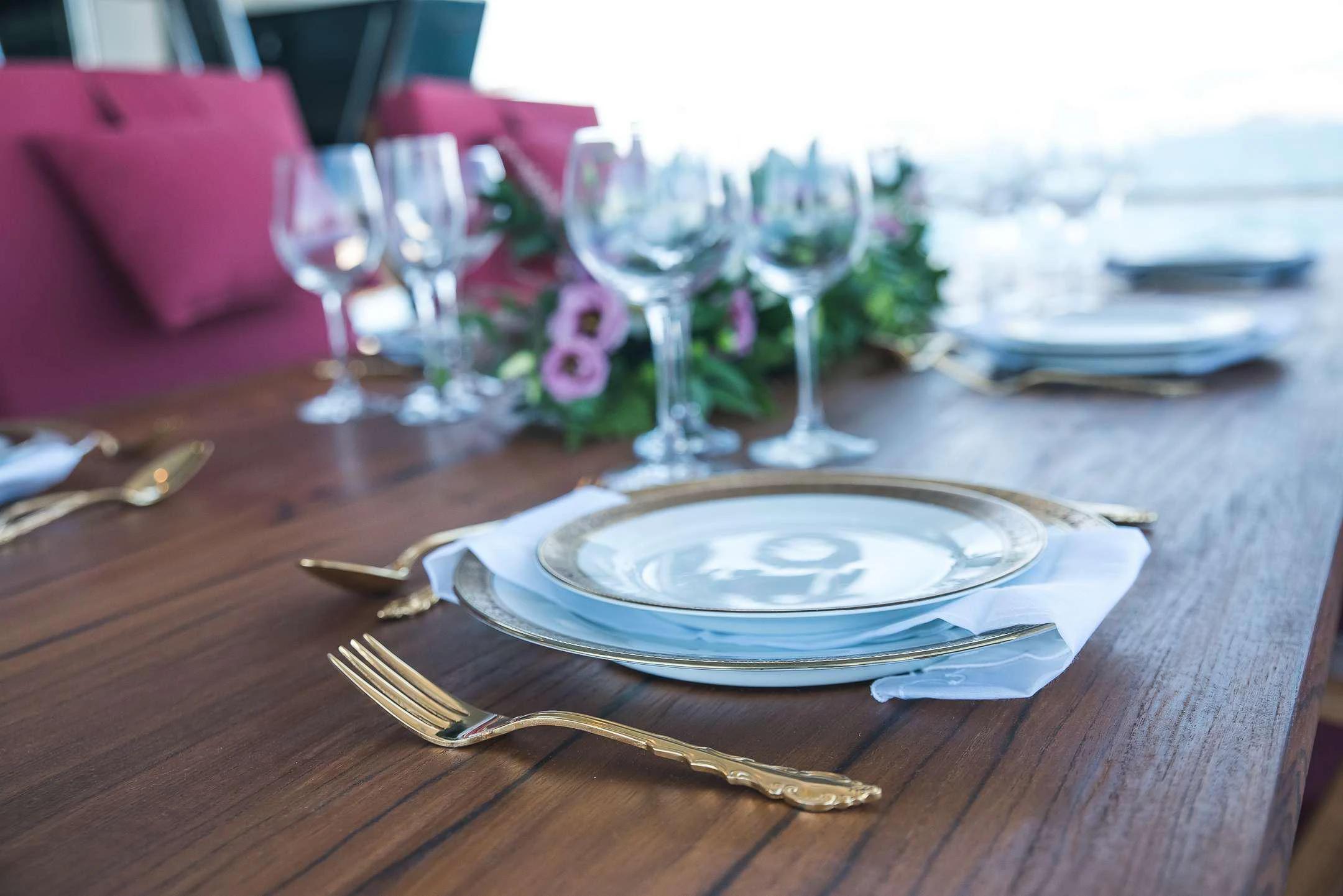 a table with place settings aboard TEMPTATION Yacht for Charter