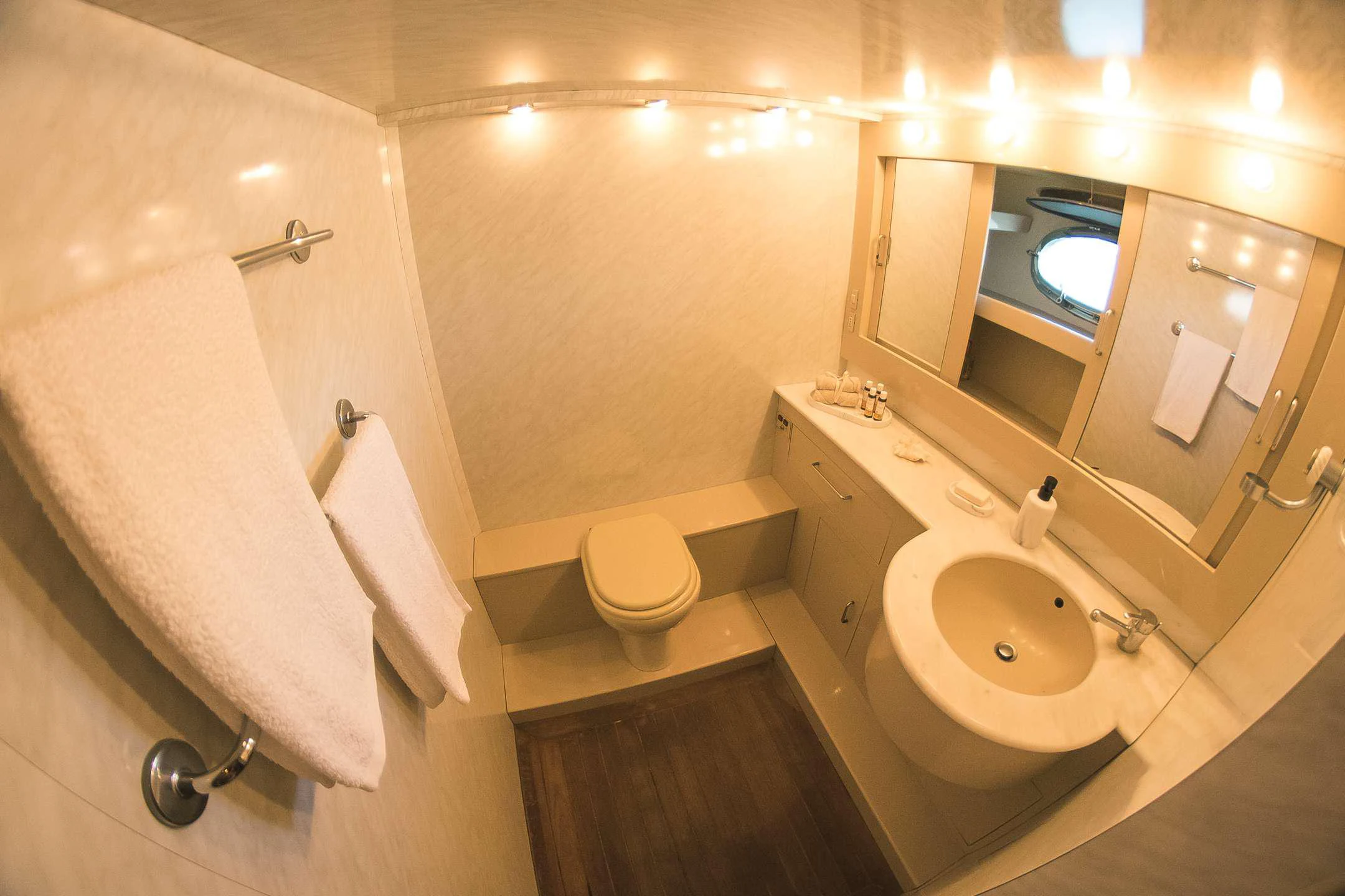 a bathroom with a sink and a toilet aboard TEMPTATION Yacht for Charter