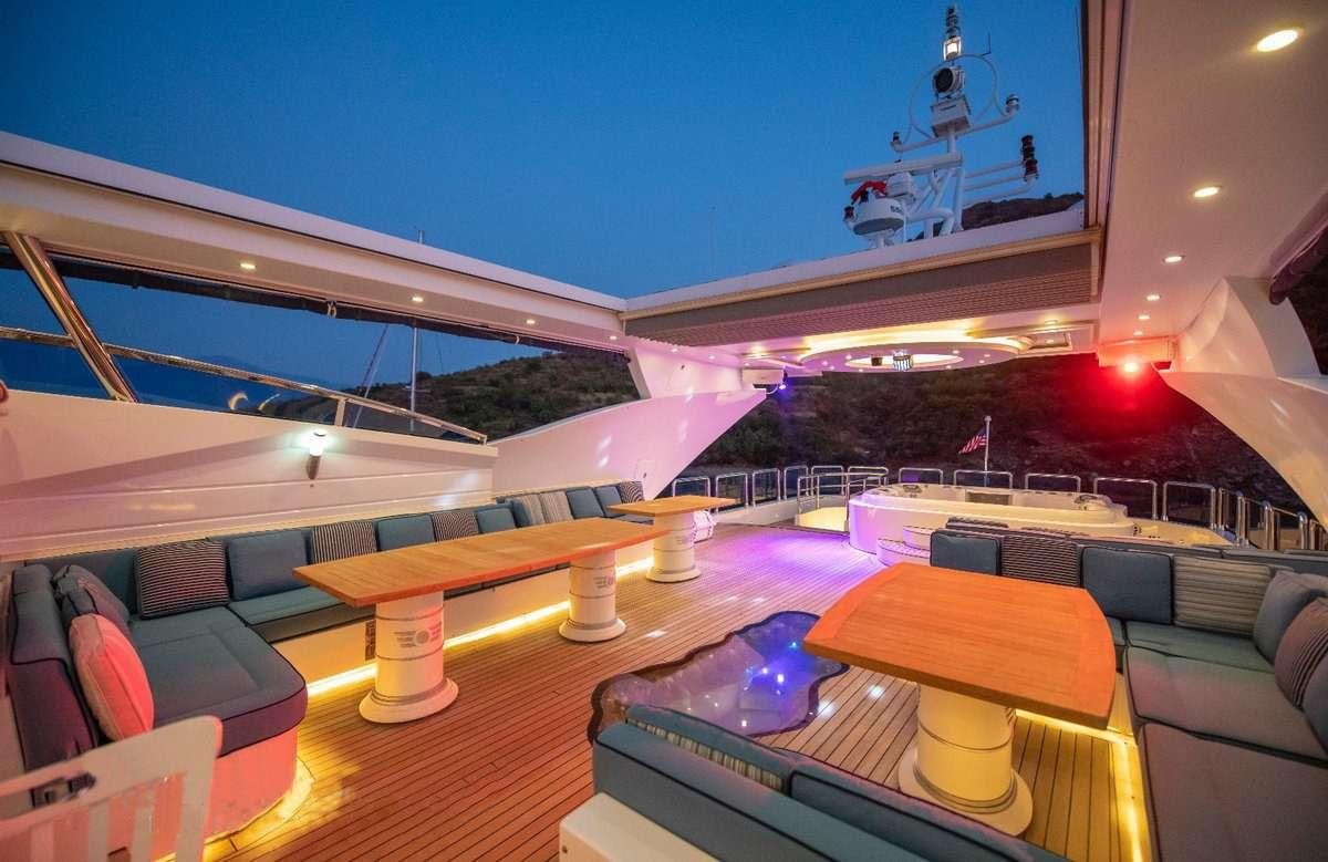 a stage with a large crowd of people and a stage with lights aboard DESTINY Yacht for Charter