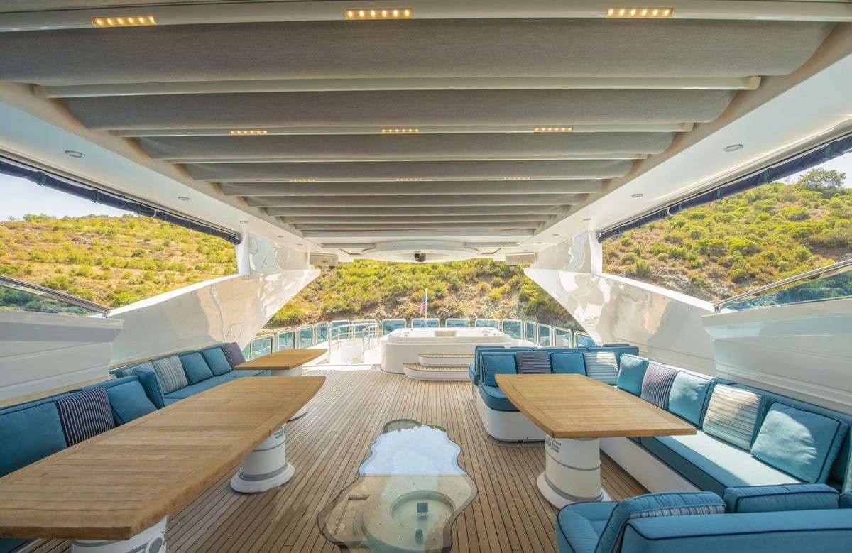 a room with a table and chairs aboard DESTINY Yacht for Charter