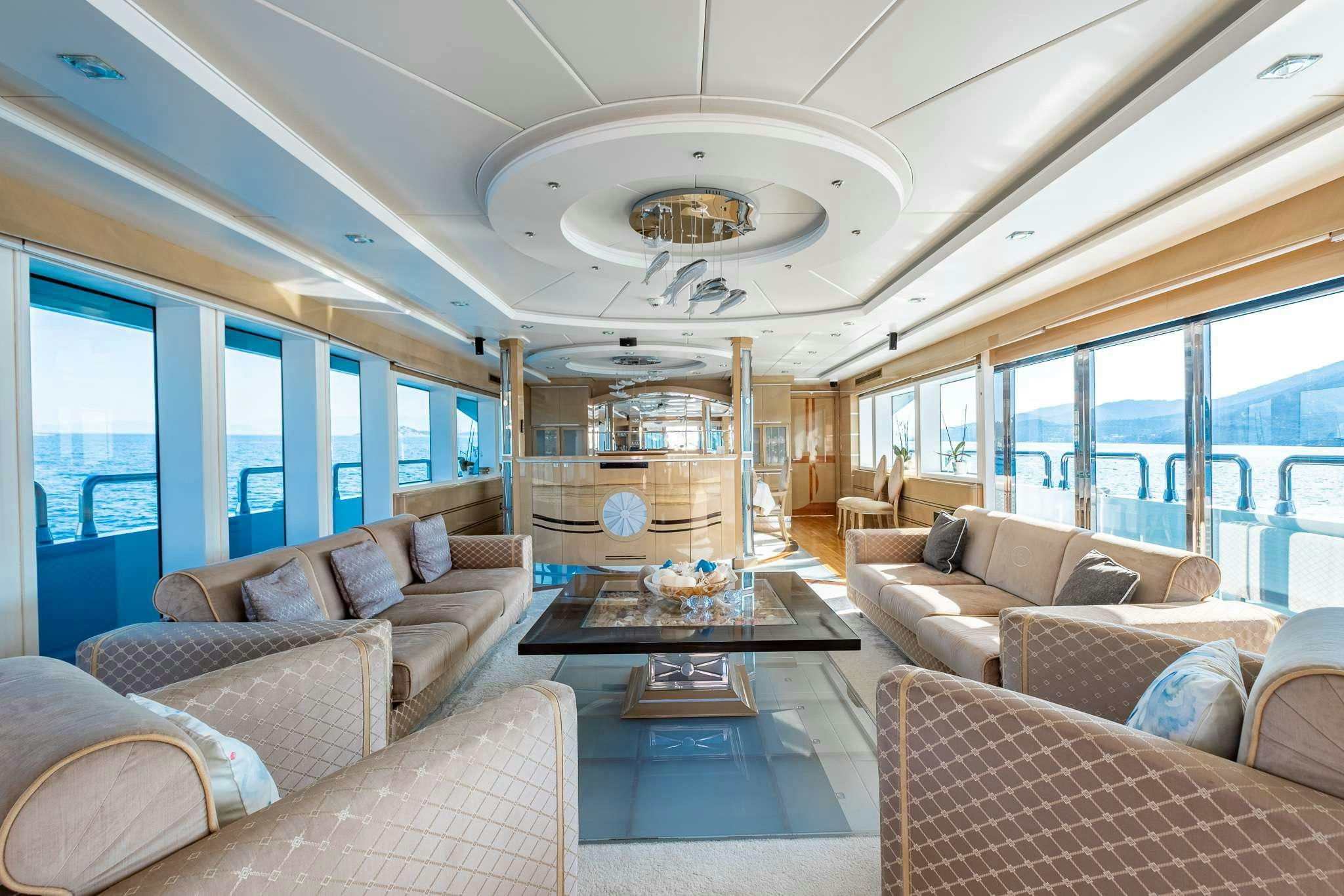 a living room with a large window aboard DESTINY Yacht for Charter