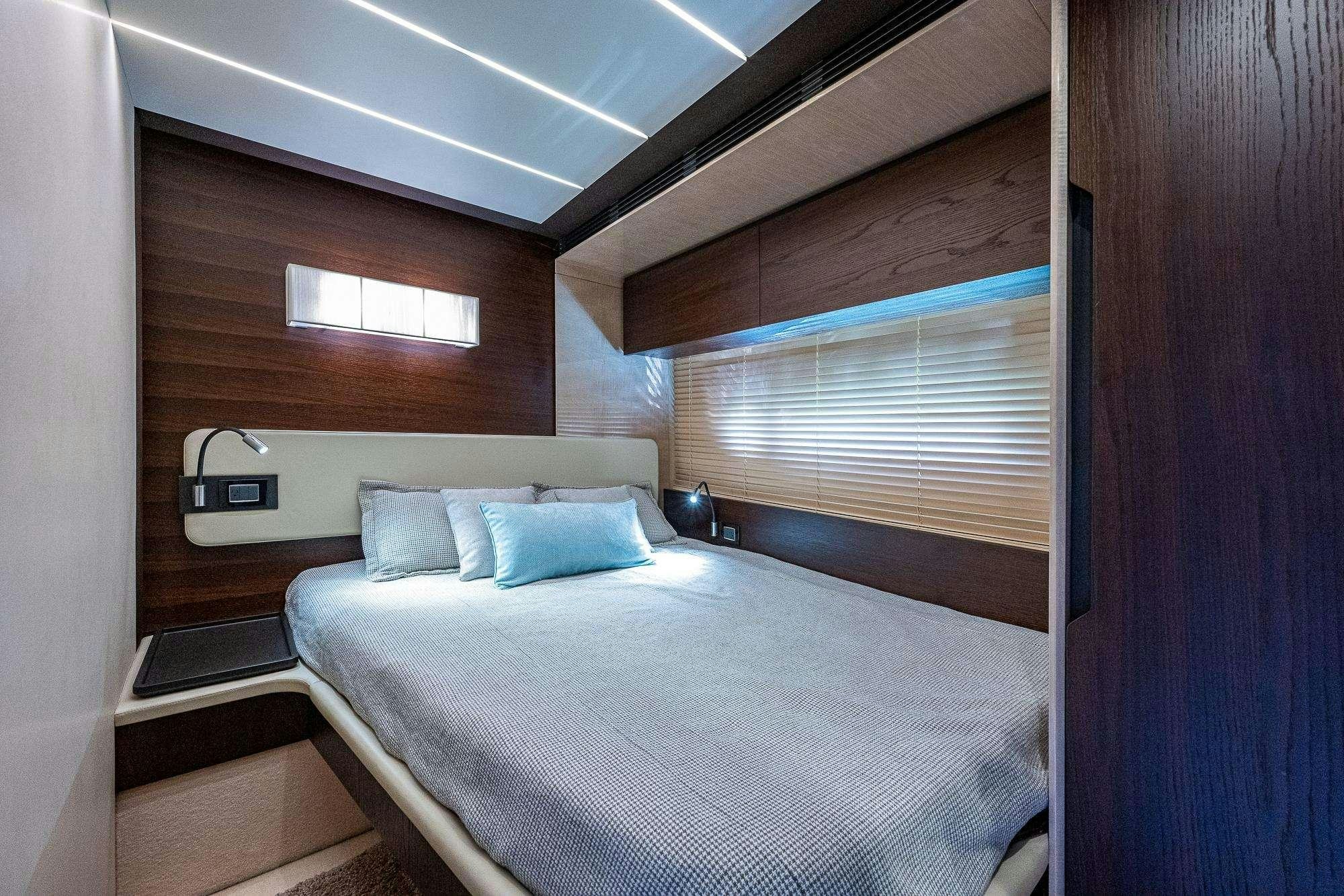 a room with a bed and a window aboard STAYSEA Yacht for Charter
