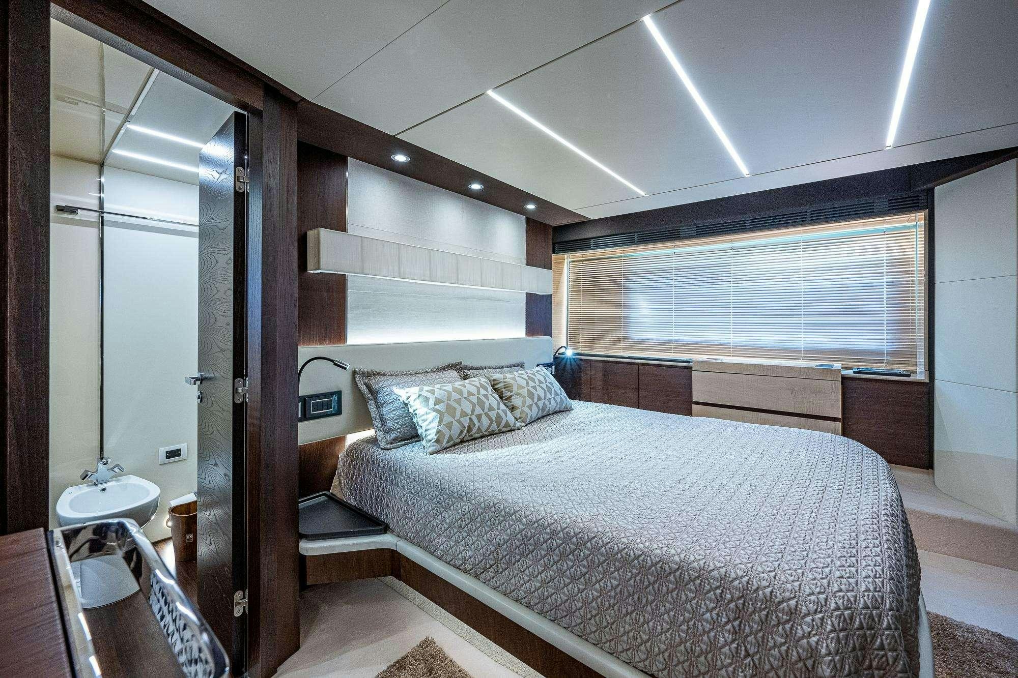a bedroom with a large bed aboard STAYSEA Yacht for Charter