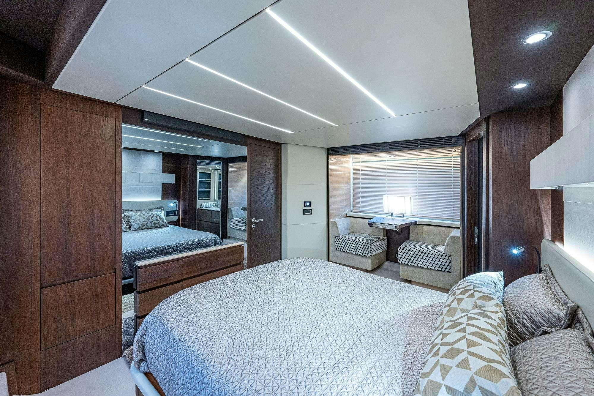 a bedroom with a bed and a desk aboard STAYSEA Yacht for Charter