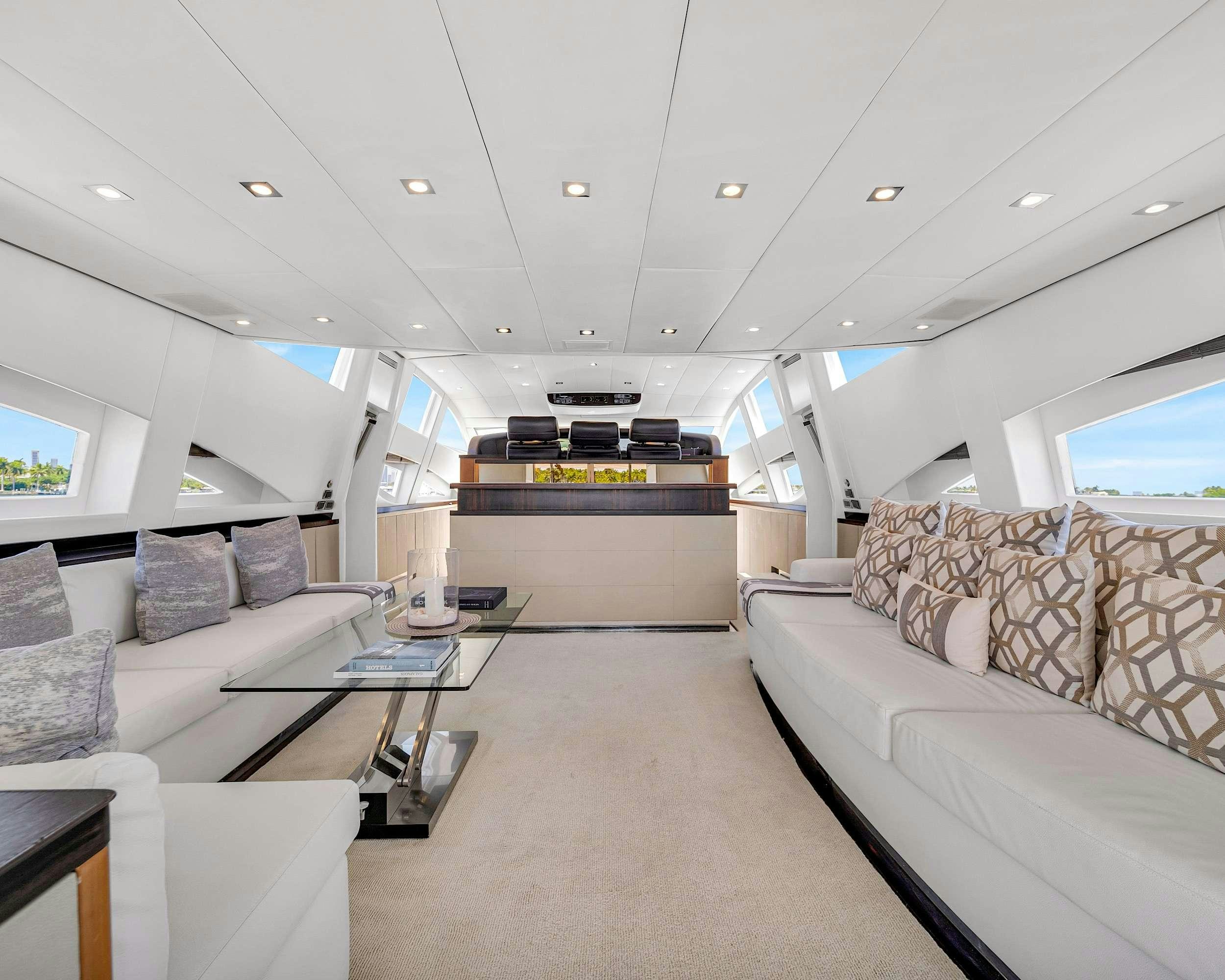 a room with couches and a table aboard CARPE DIEM Yacht for Charter