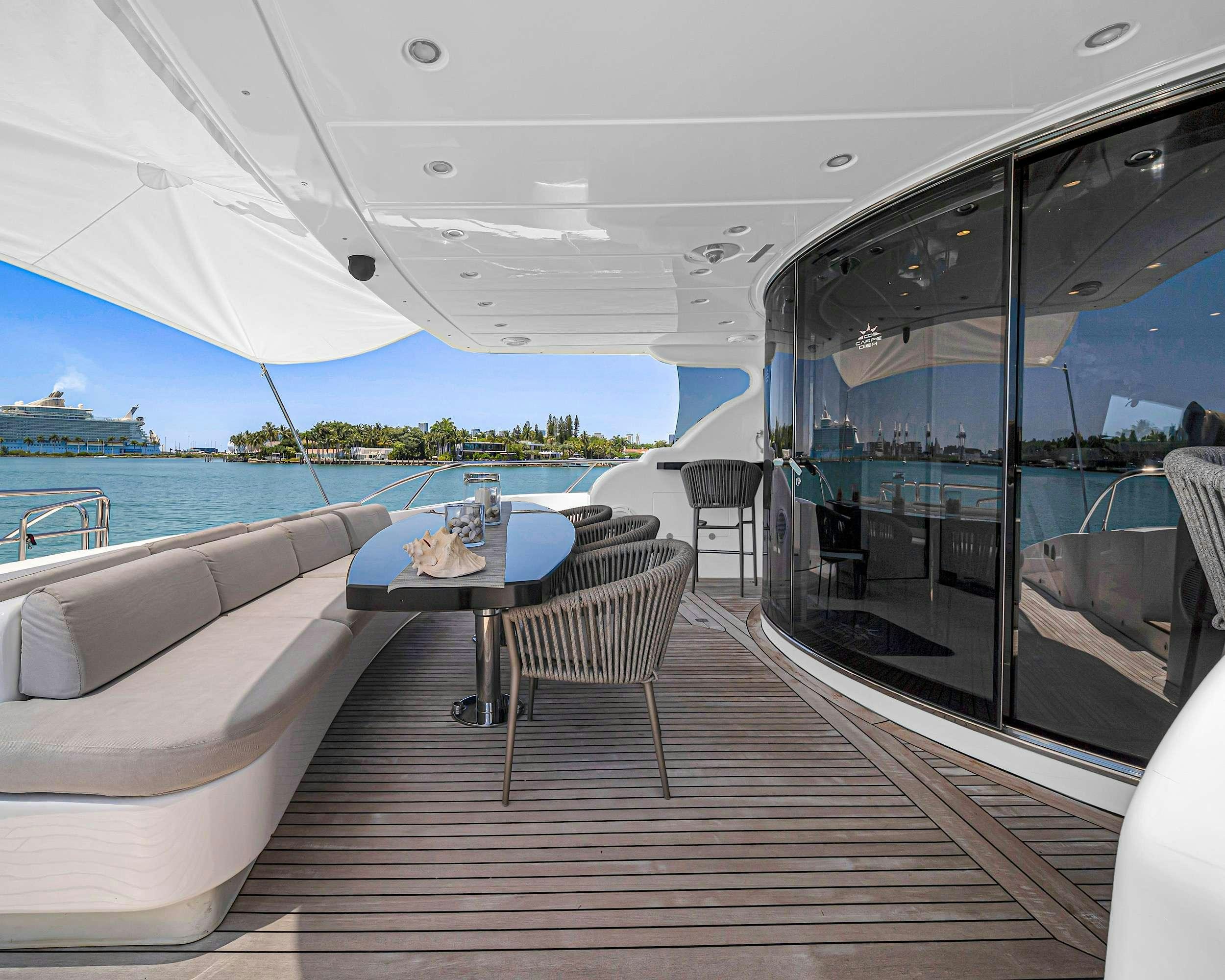 a room with a table and chairs aboard CARPE DIEM Yacht for Charter