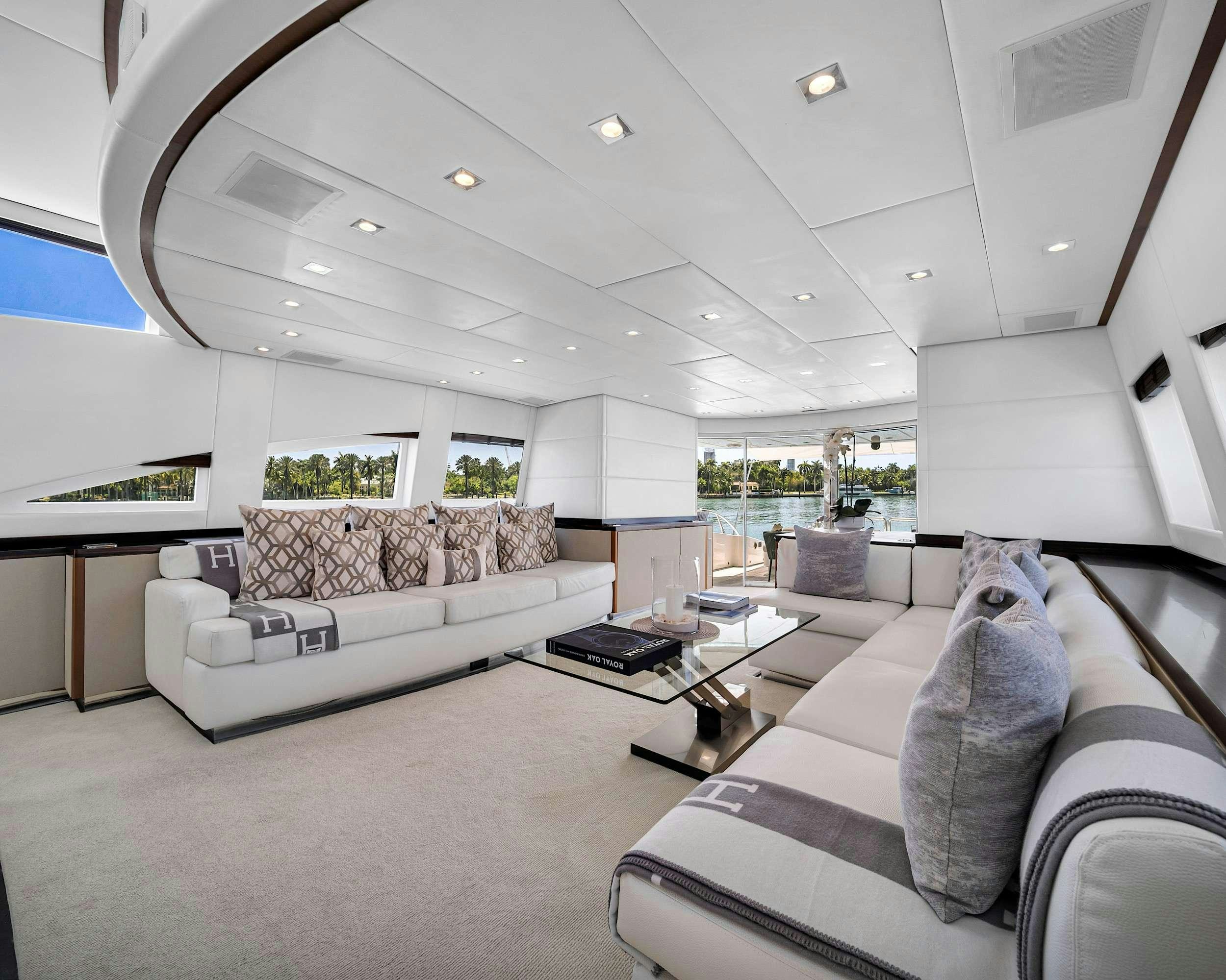 a living room with a couch and a coffee table aboard CARPE DIEM Yacht for Charter