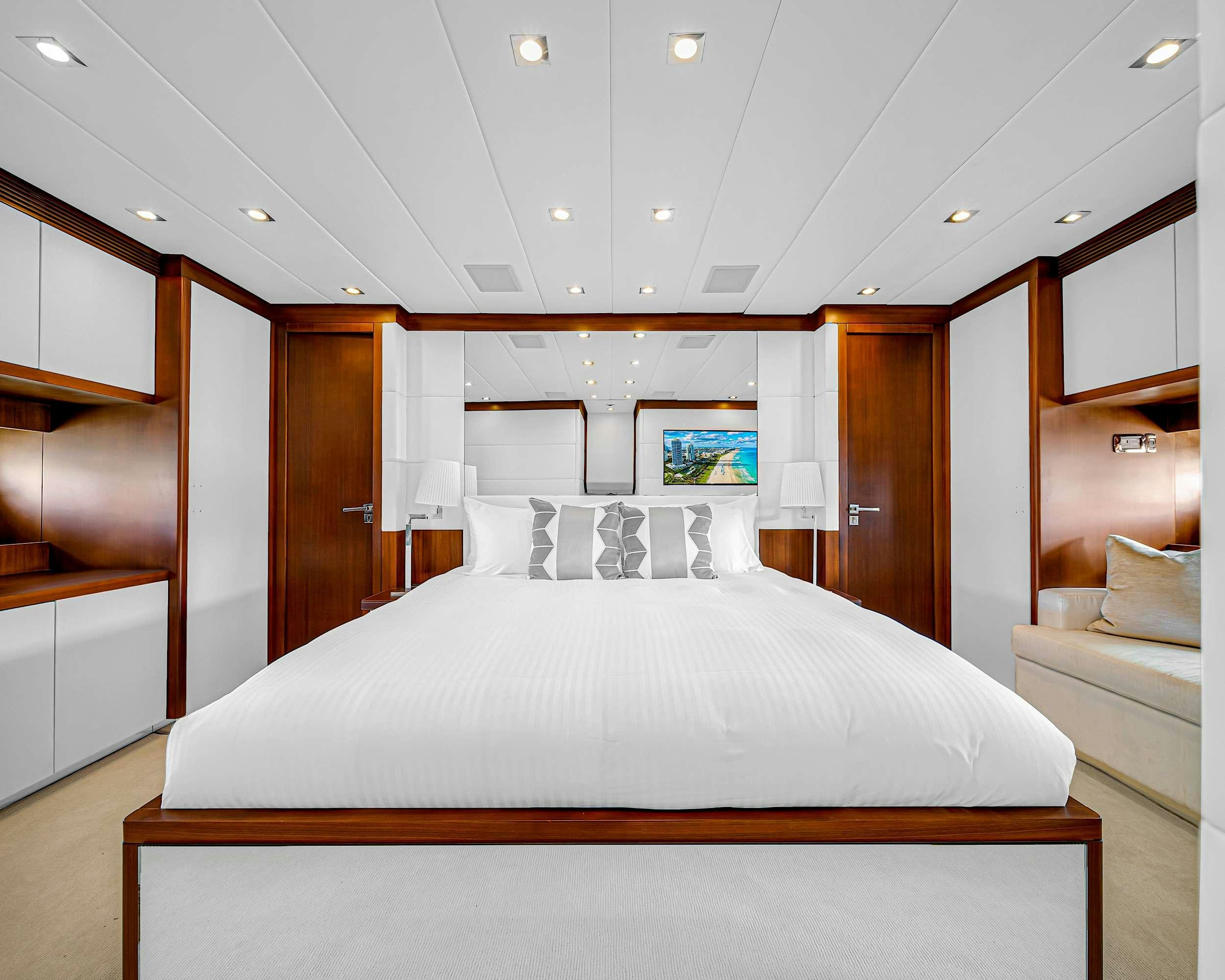 a large bedroom with a large bed aboard CARPE DIEM Yacht for Charter