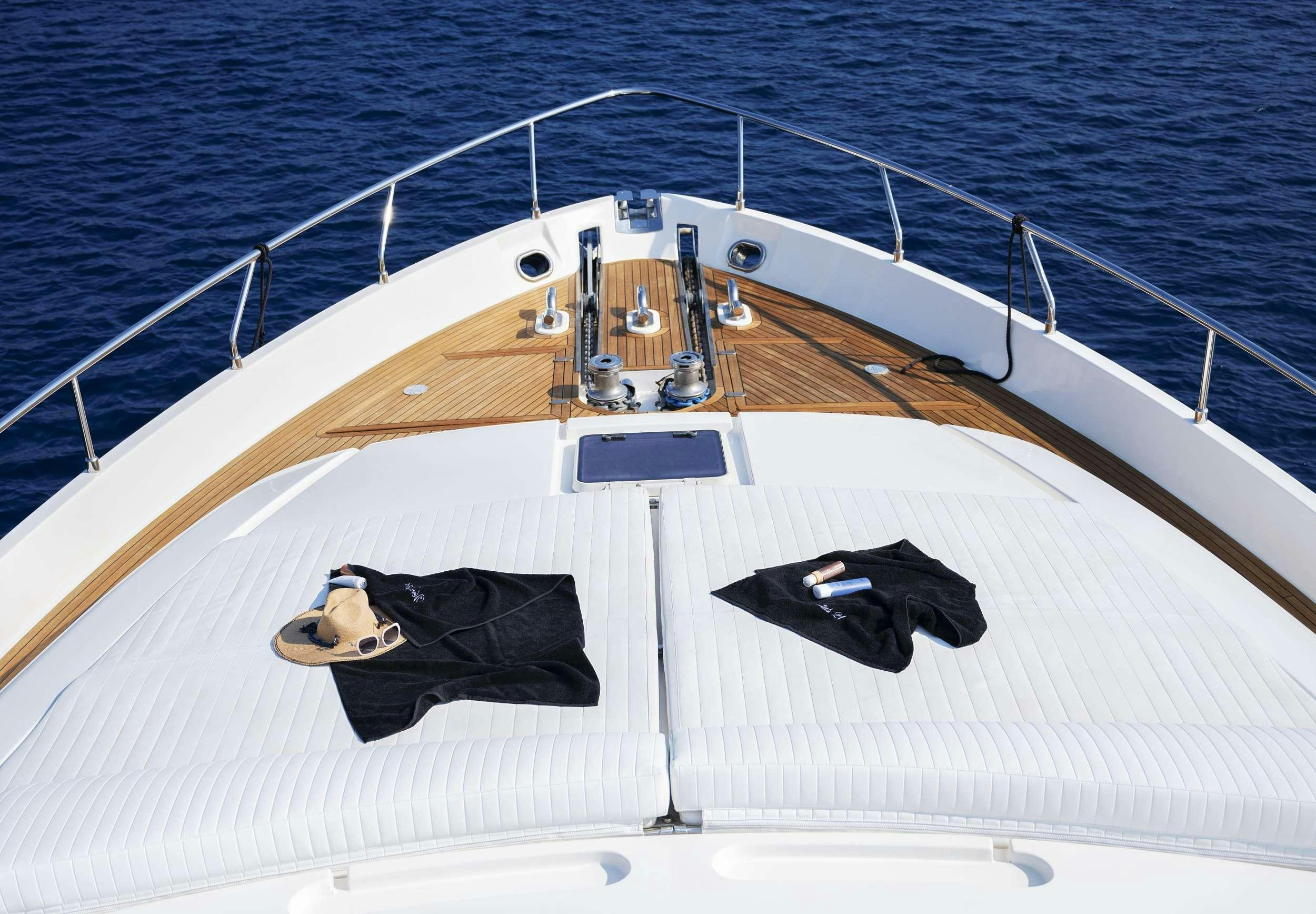 a person lying on a boat aboard VENTUS 21 Yacht for Charter