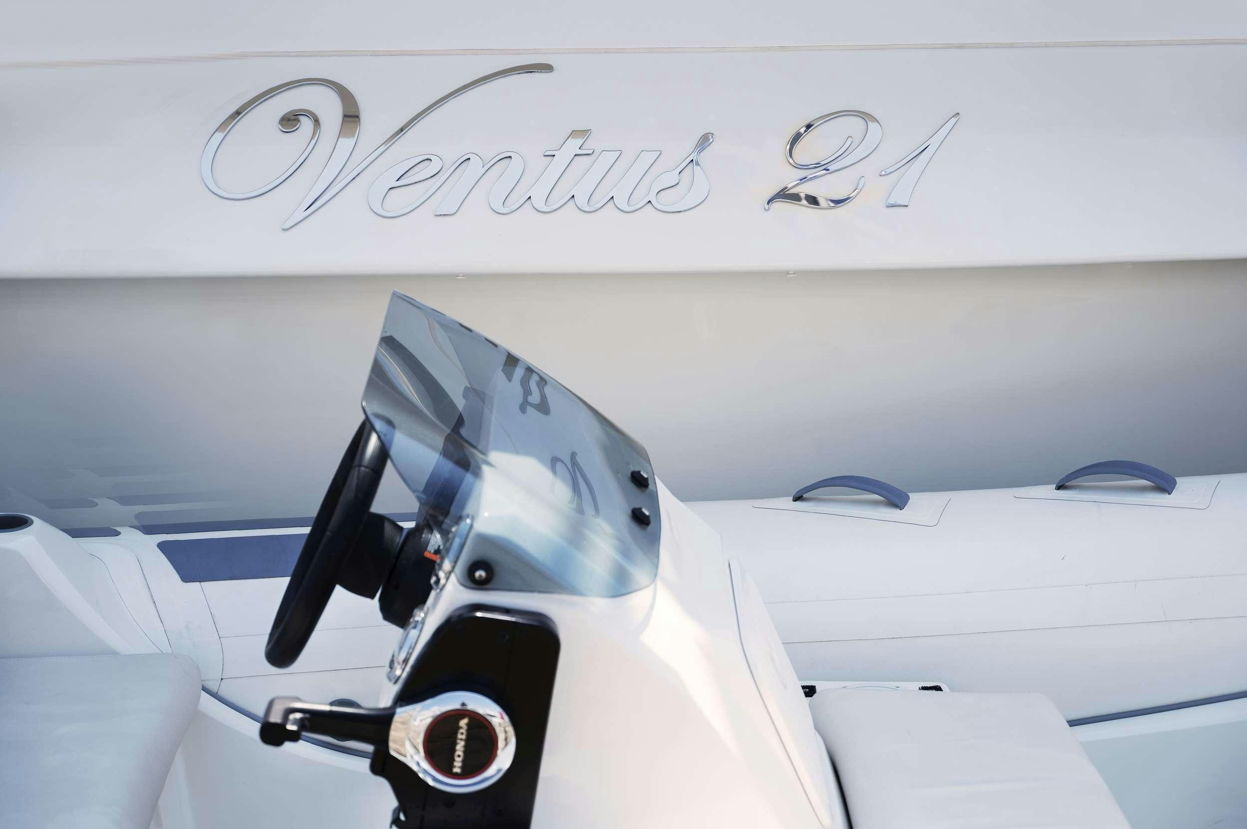 a white airplane with a black propeller aboard VENTUS 21 Yacht for Charter
