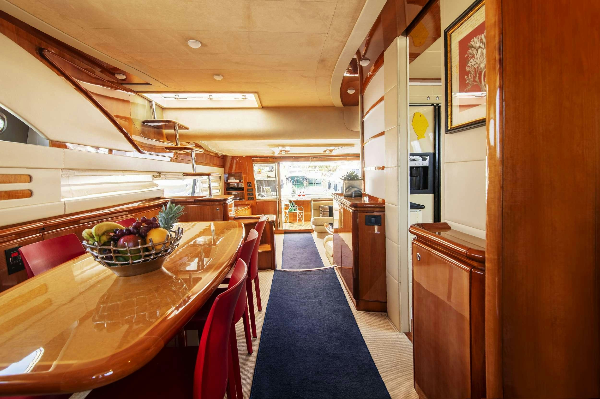 a kitchen with a table and chairs aboard VENTUS 21 Yacht for Charter