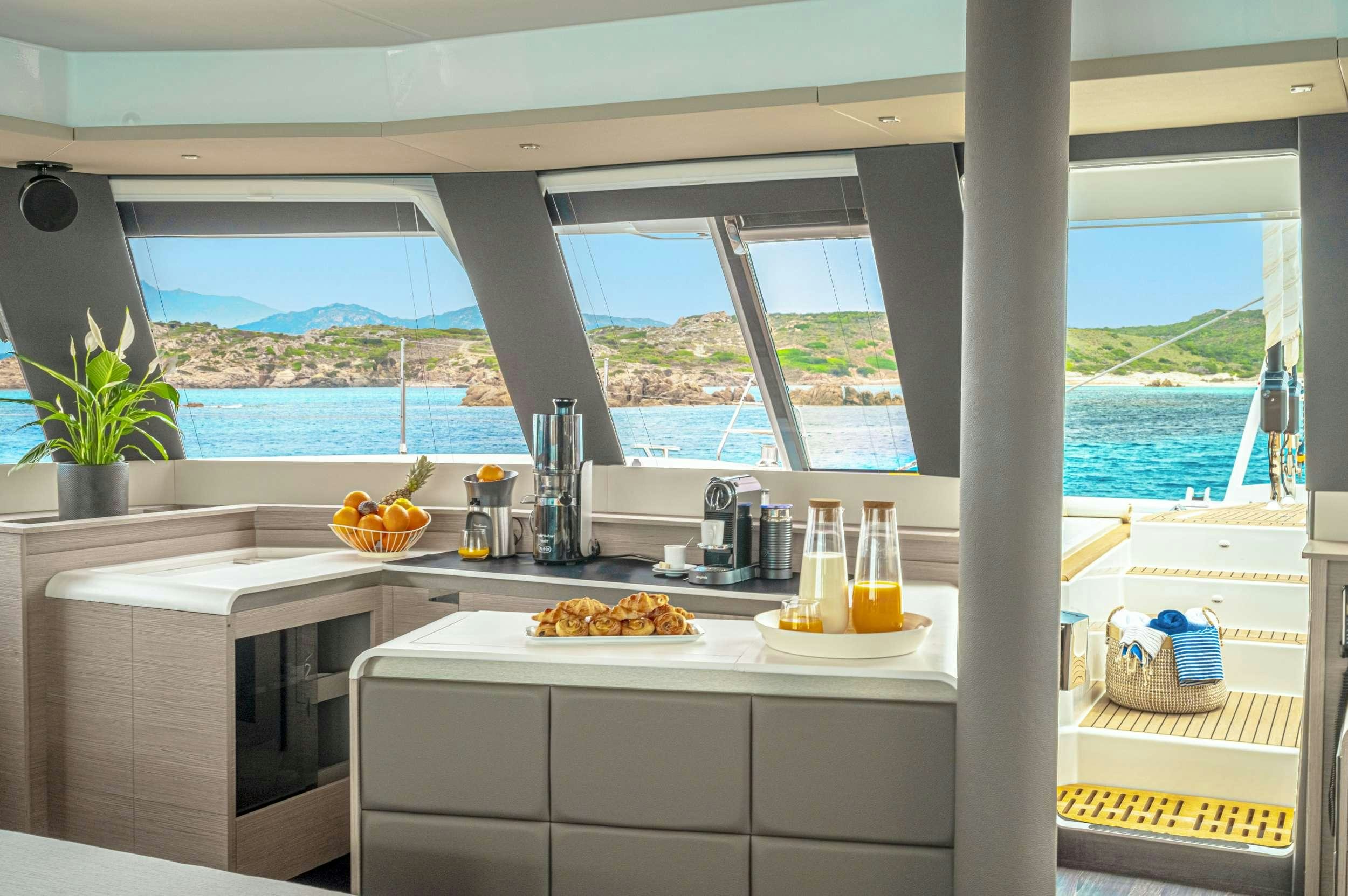 a kitchen with a view of the ocean aboard SEMPER FIDELIS Yacht for Charter