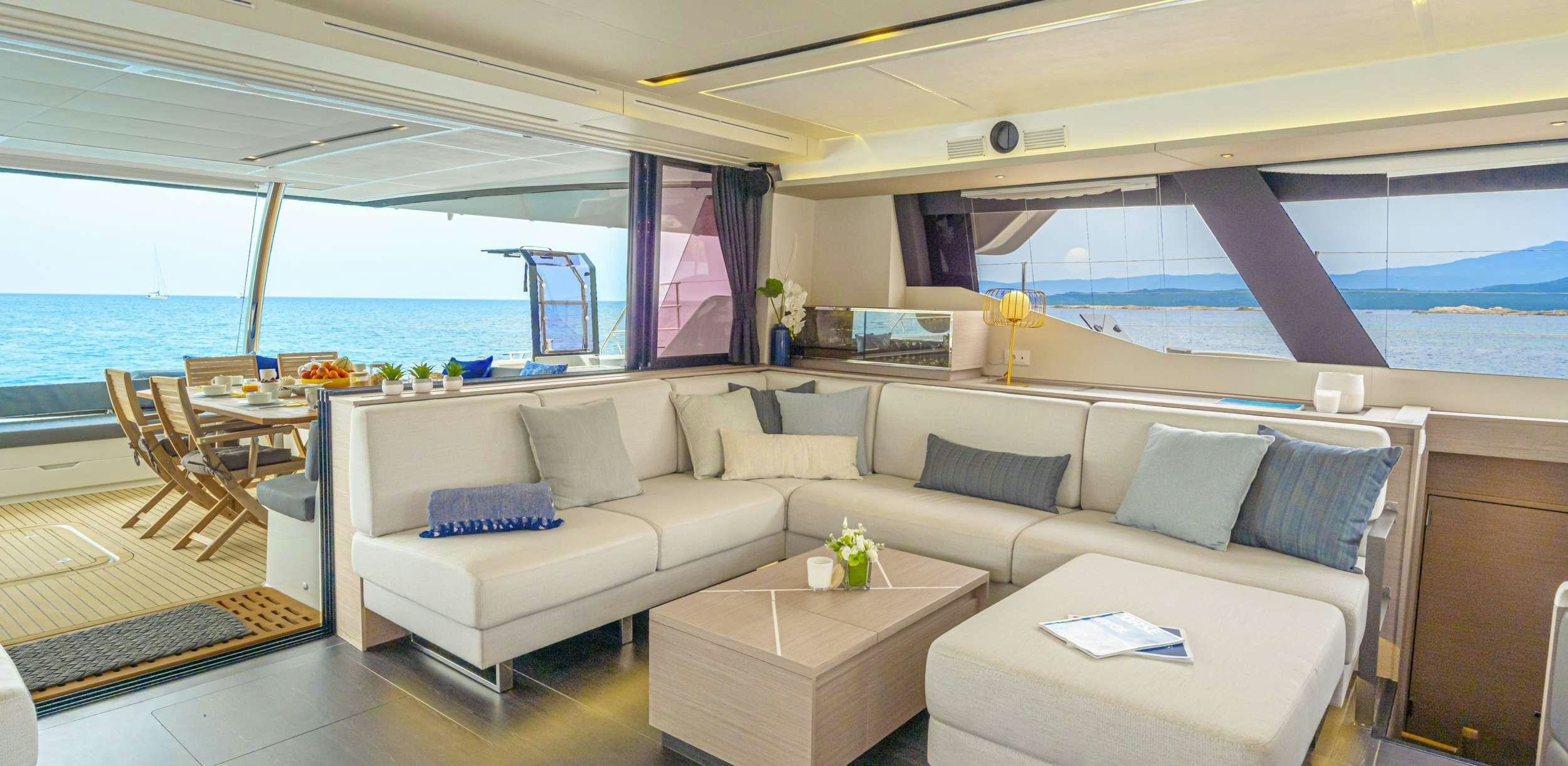 a living room with a large window aboard SEMPER FIDELIS Yacht for Charter