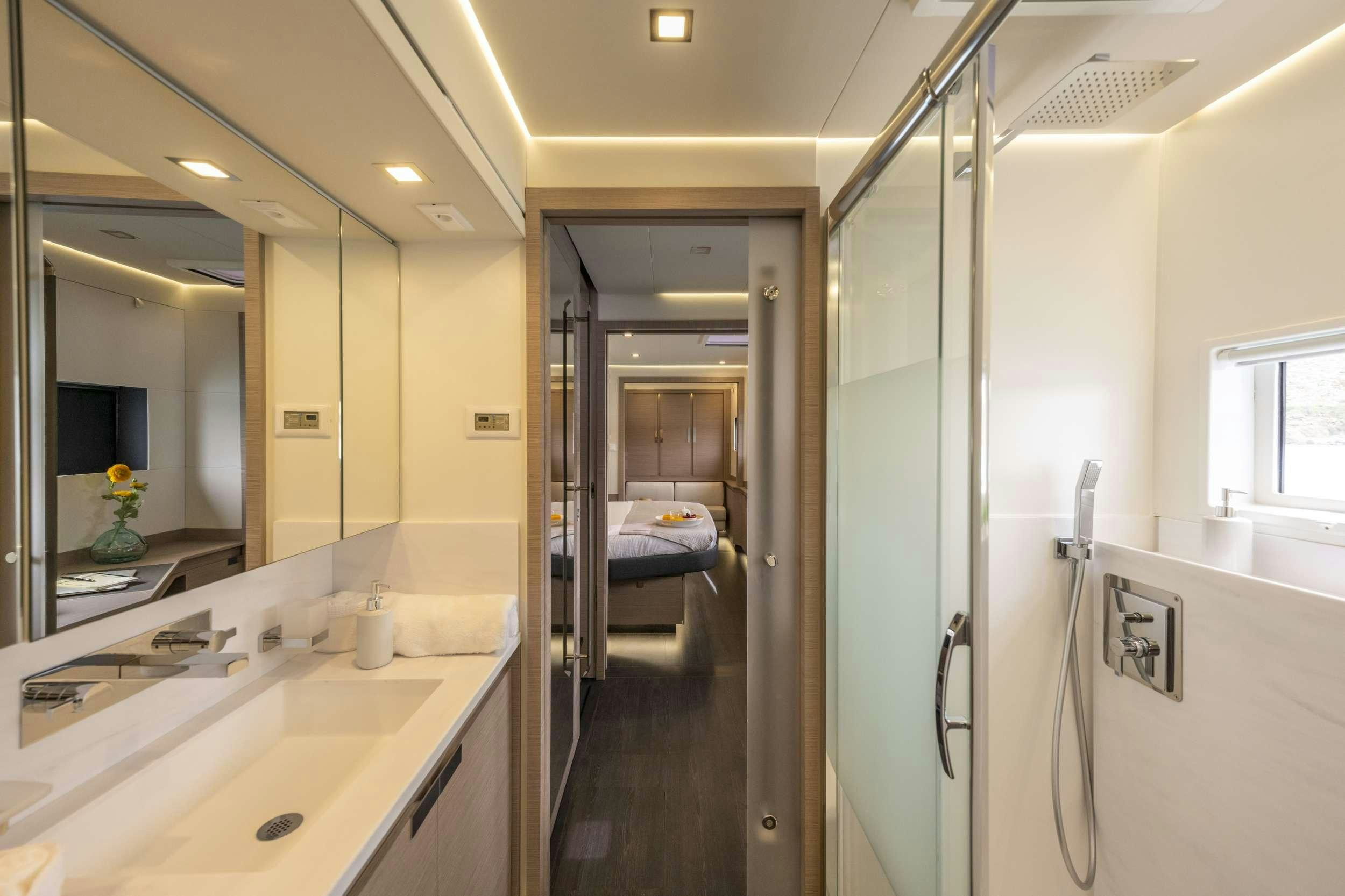 a bathroom with a glass shower aboard SEMPER FIDELIS Yacht for Charter