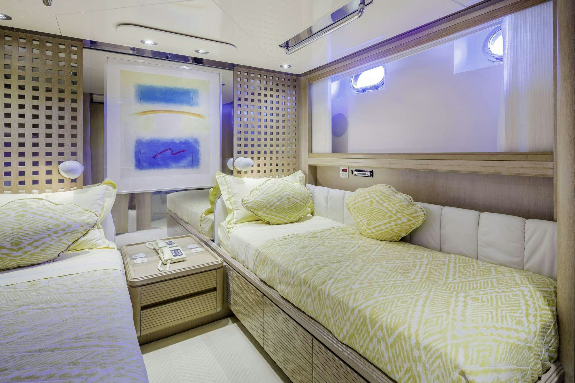 a room with two beds aboard NOMMO Yacht for Charter