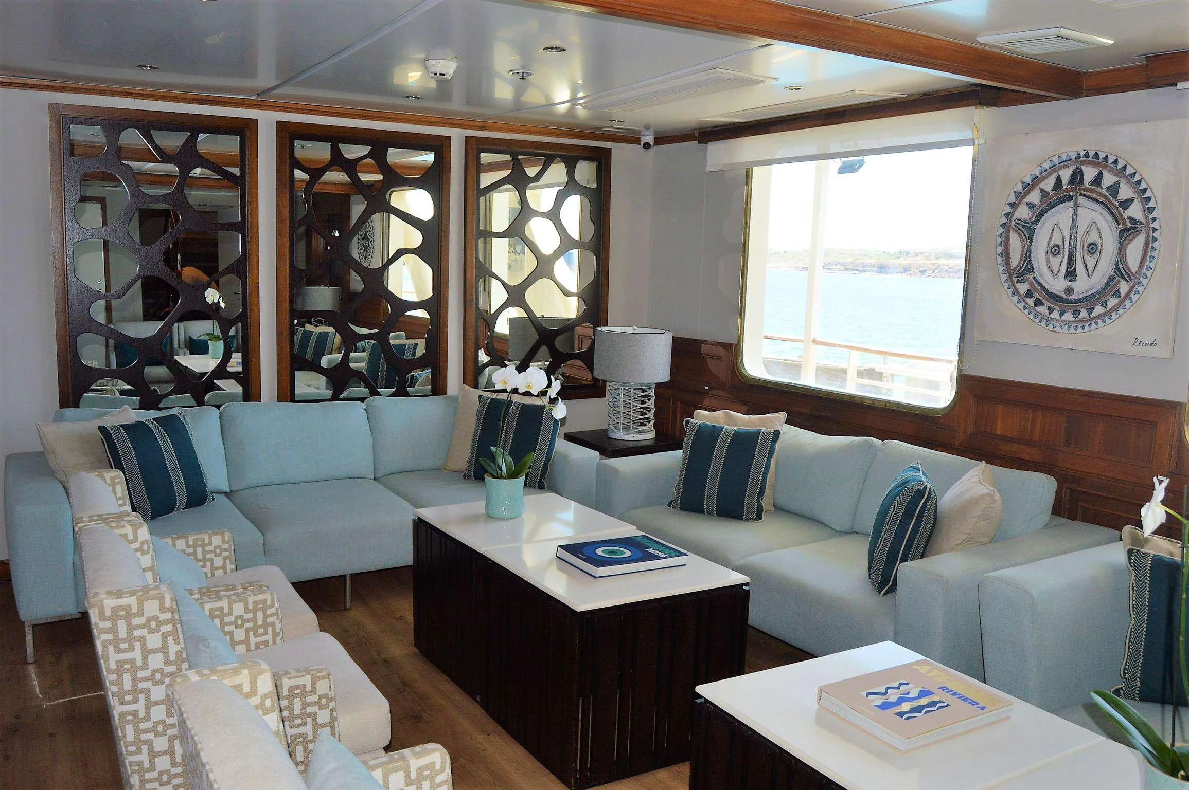 a living room with a couch and a coffee table aboard ELYSIUM Yacht for Charter