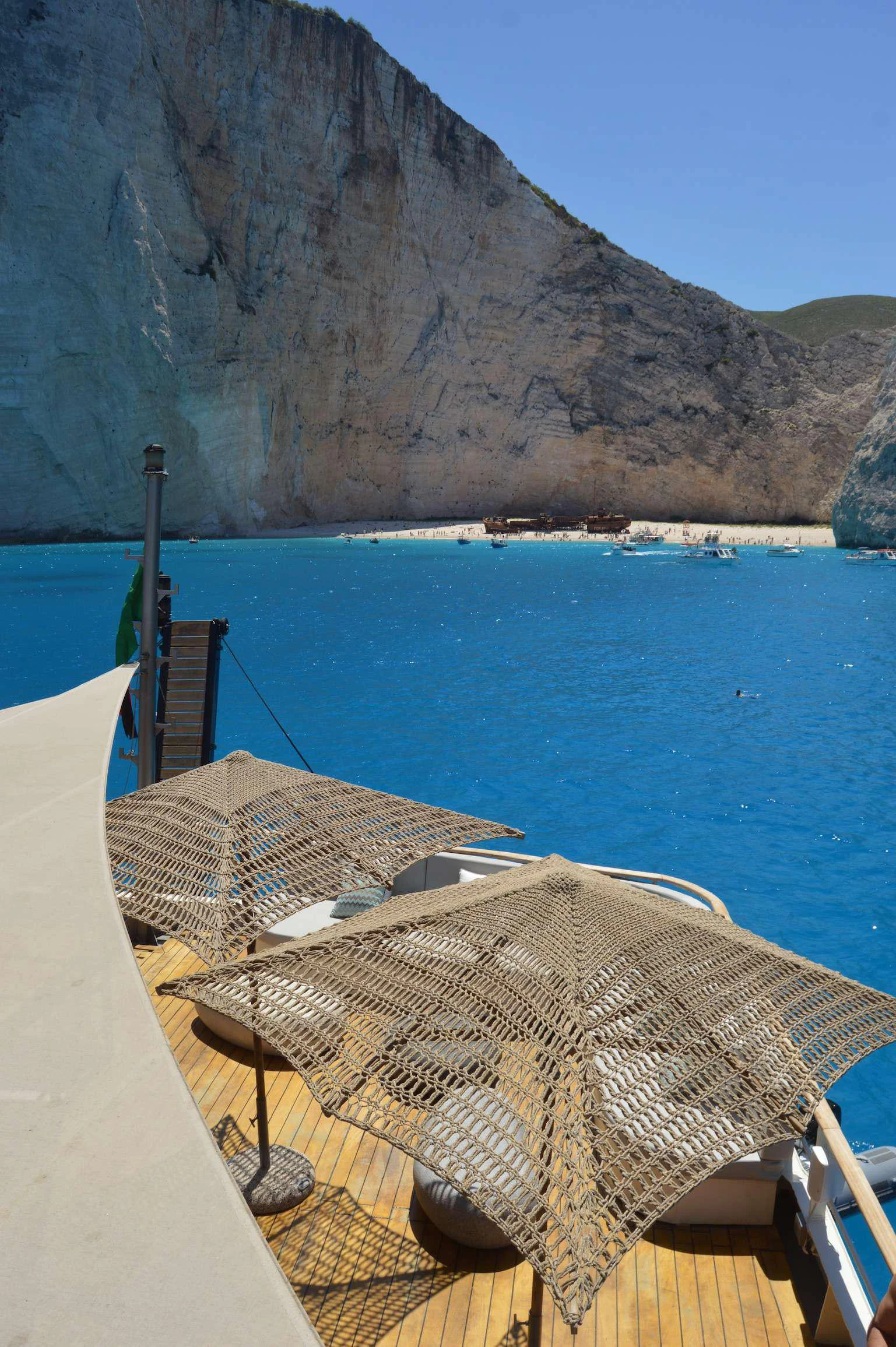 a straw umbrella on a boat aboard ELYSIUM Yacht for Charter