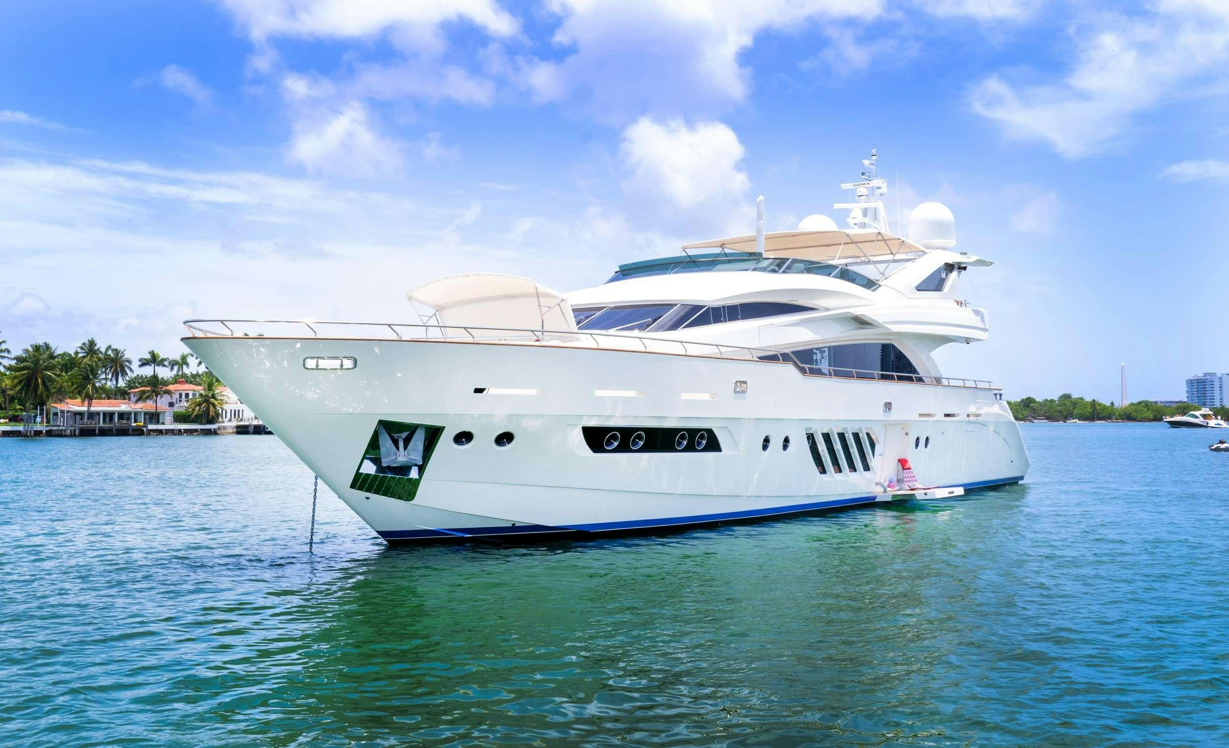 a white boat in the water aboard 95 DOMINATOR Yacht for Charter