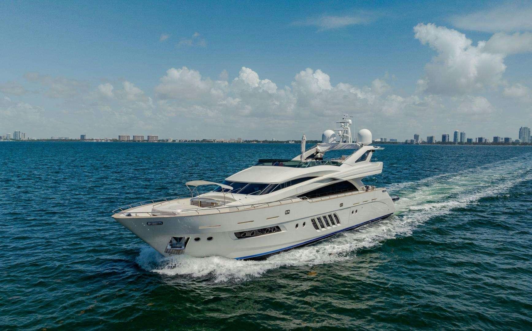 a white boat on the water aboard 95 DOMINATOR Yacht for Charter