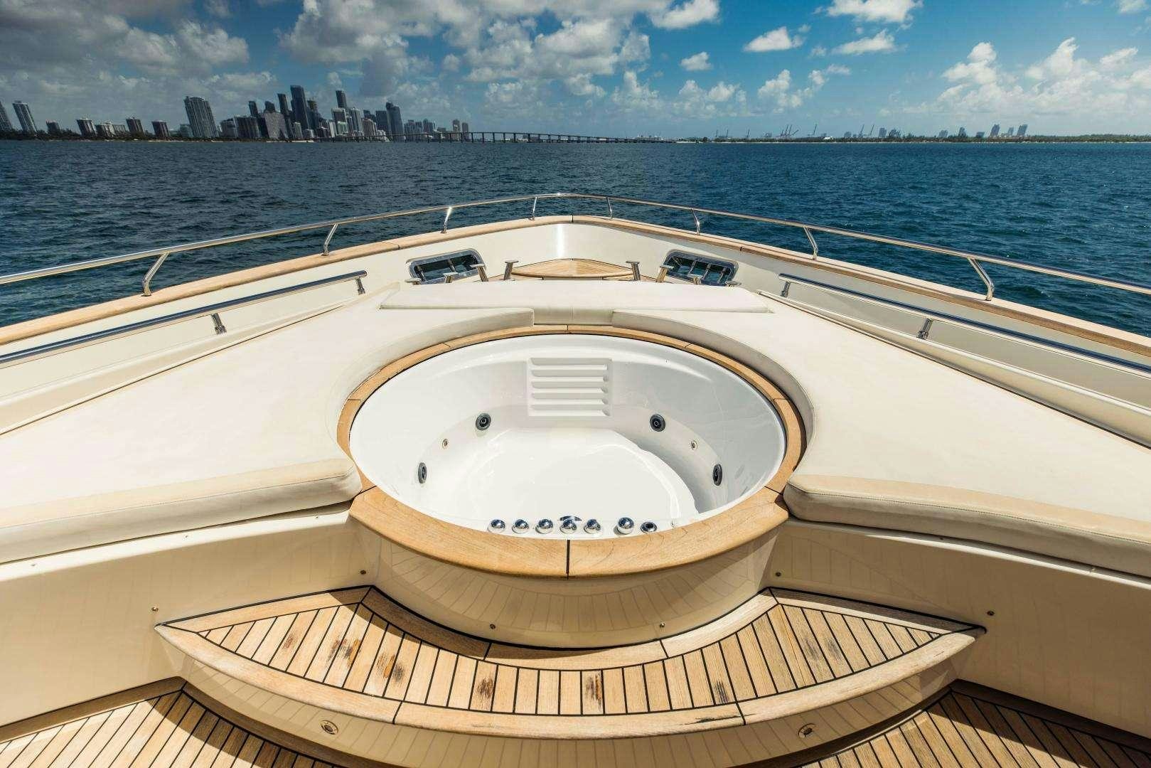 a large white boat on a body of water aboard 95 DOMINATOR Yacht for Charter