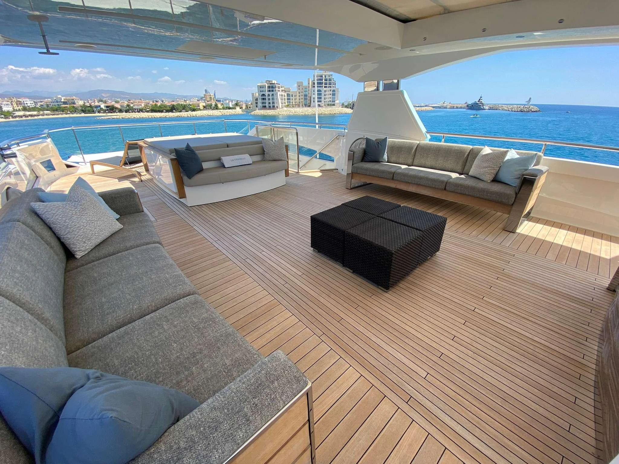The spacious flybridge offers ample seating and stunning views of the surrounding waters. aboard LE VERSEAU Yacht for Charter