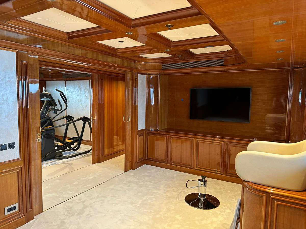 a room with a tv and a chair aboard ISABELL PRINCESS OF THE SEA Yacht for Charter