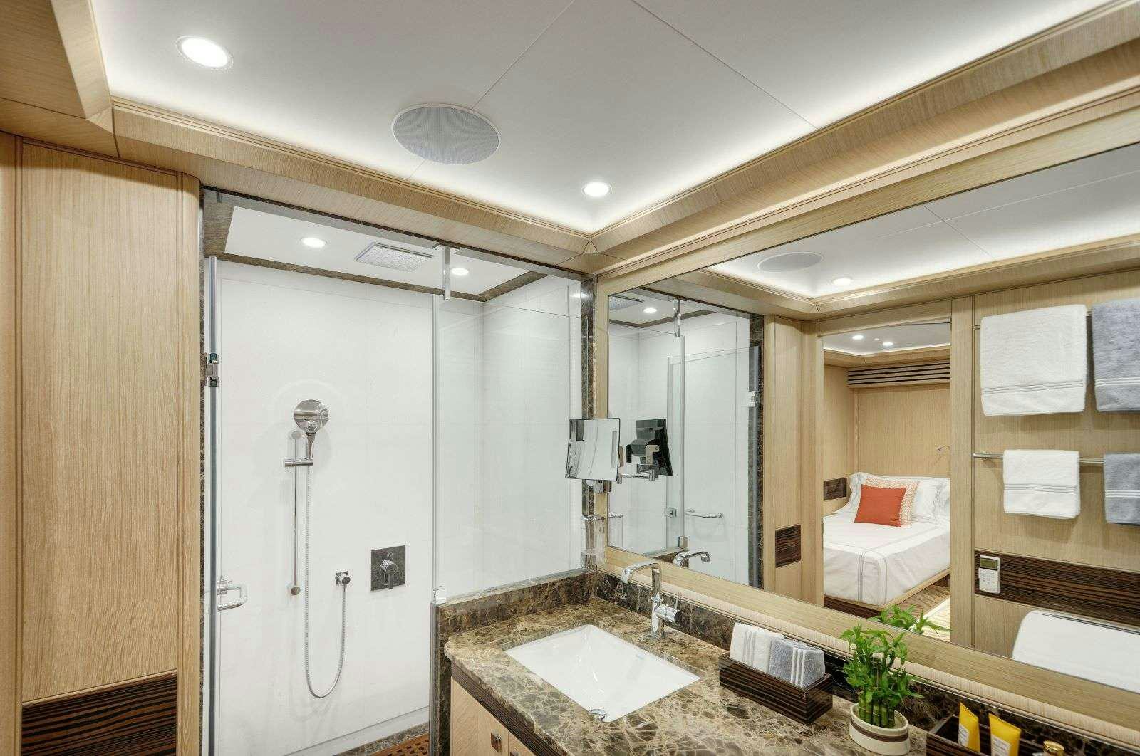 a bathroom with a large mirror aboard THAT'S AMORE Yacht for Charter