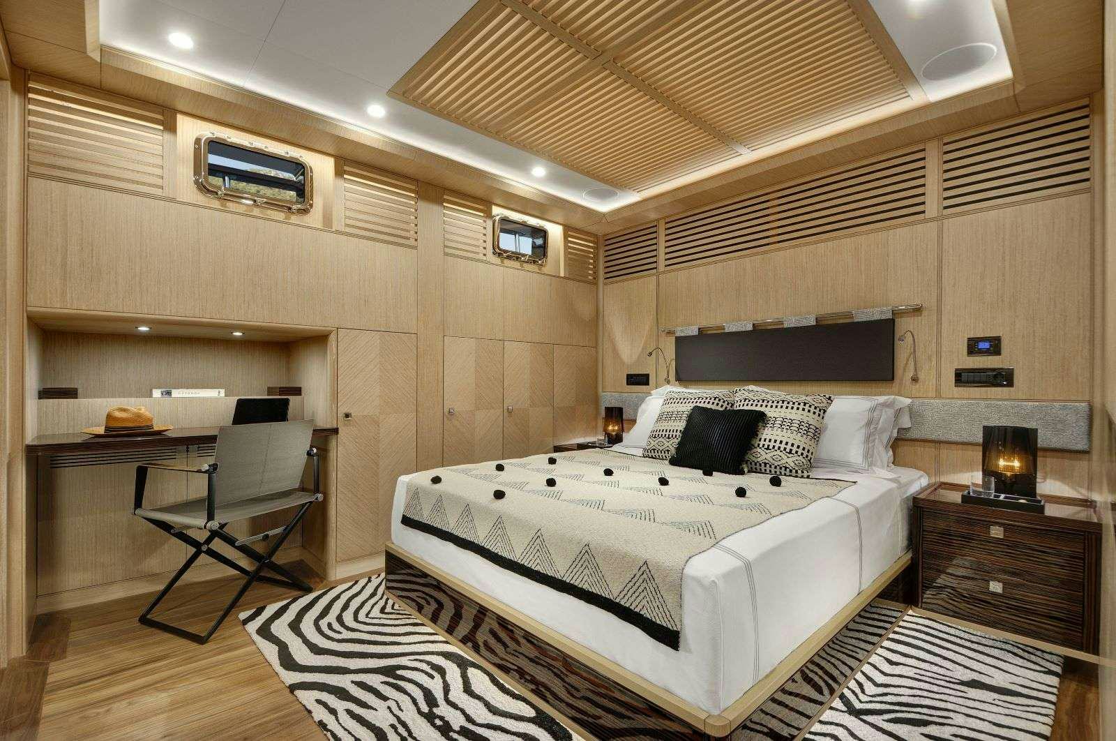 a large bedroom with a bed aboard THAT'S AMORE Yacht for Charter