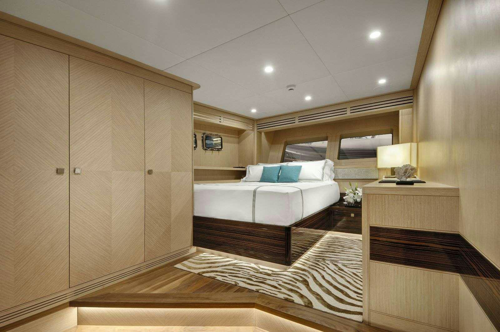 a room with a bed and a couch aboard THAT'S AMORE Yacht for Charter