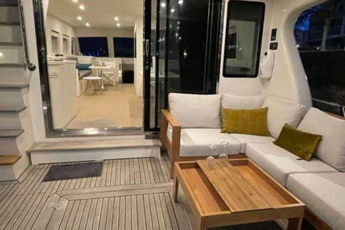 a living room with a wood table aboard FLAMENGA Yacht for Charter