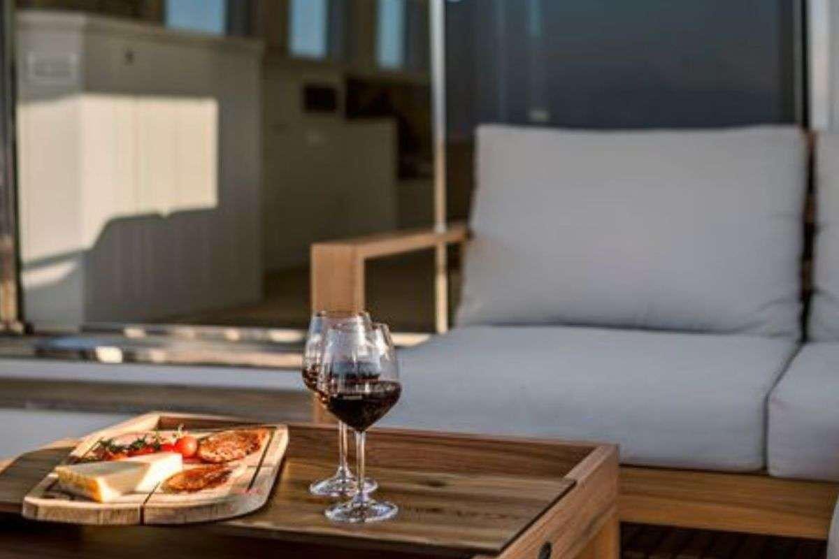 a glass of wine on a table aboard FLAMENGA Yacht for Charter