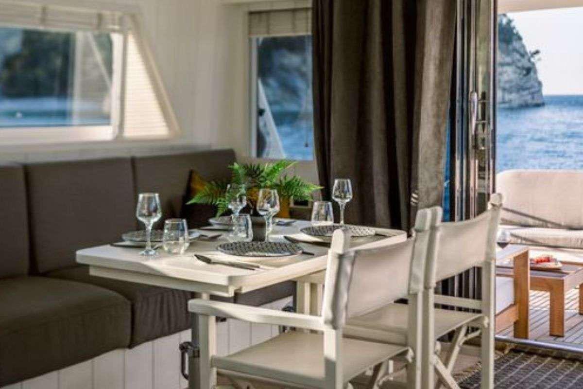 a table set for a meal aboard FLAMENGA Yacht for Charter