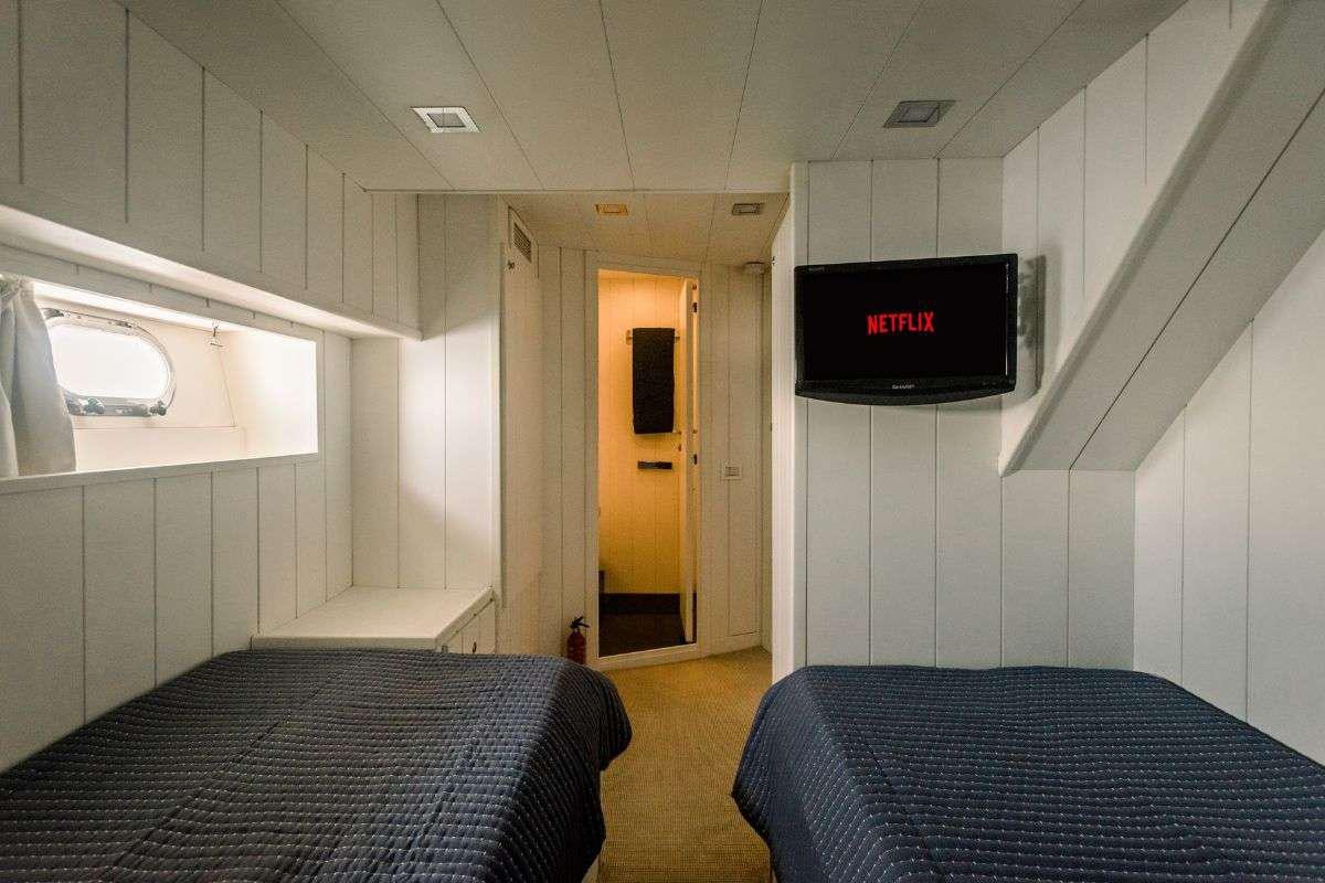 a bed in a room aboard FLAMENGA Yacht for Charter