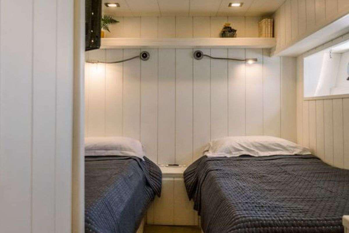 a couple of beds in a room aboard FLAMENGA Yacht for Charter