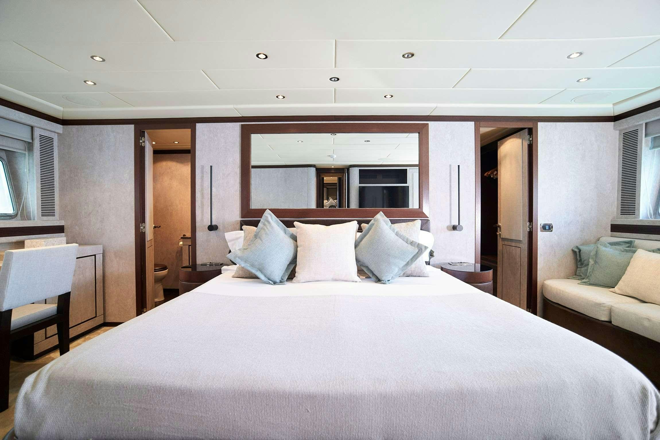 a large bed in a room aboard FIVE STARS Yacht for Charter