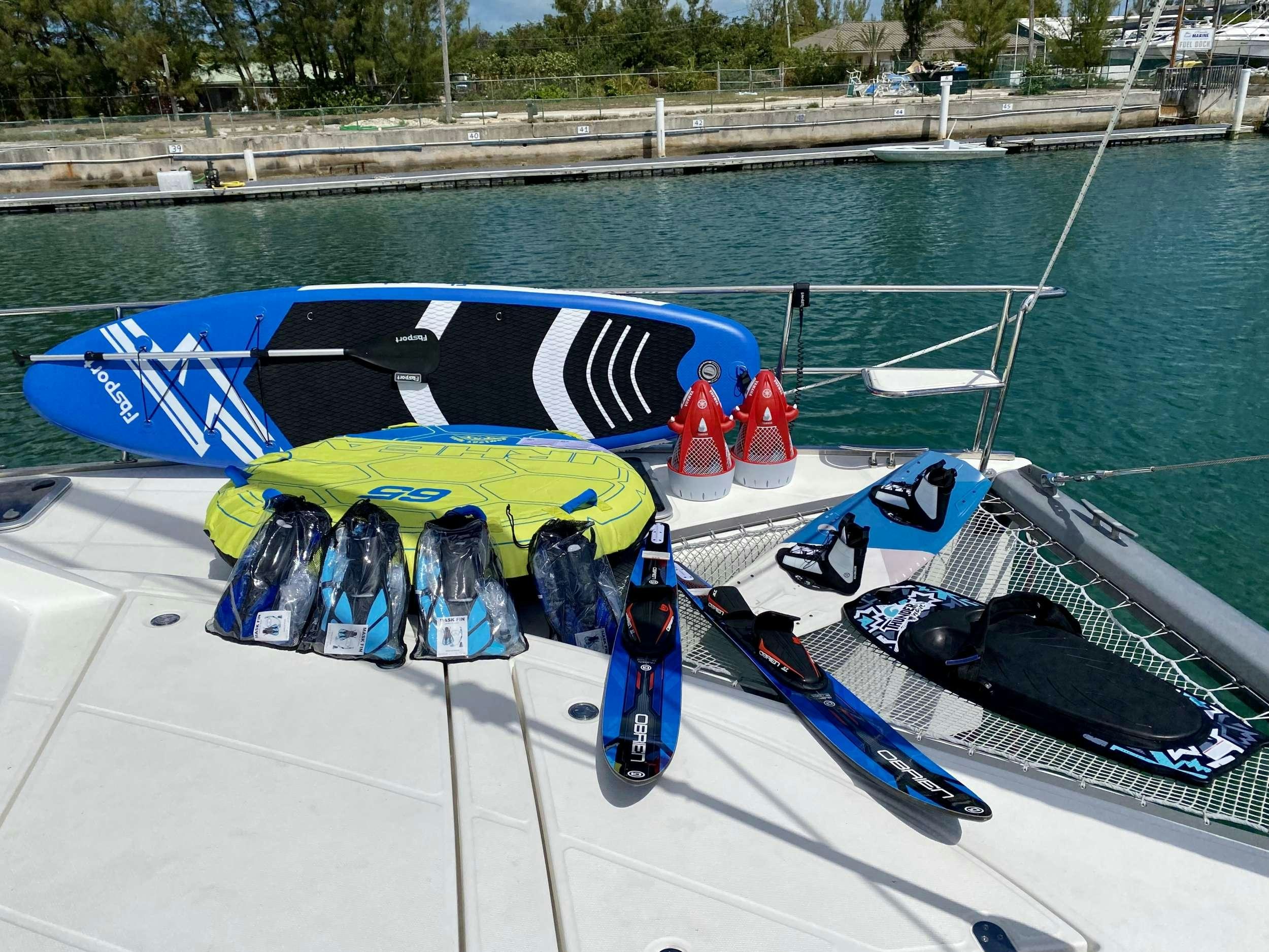 a boat with a group of kayaks on it aboard WEIHAII Yacht for Charter